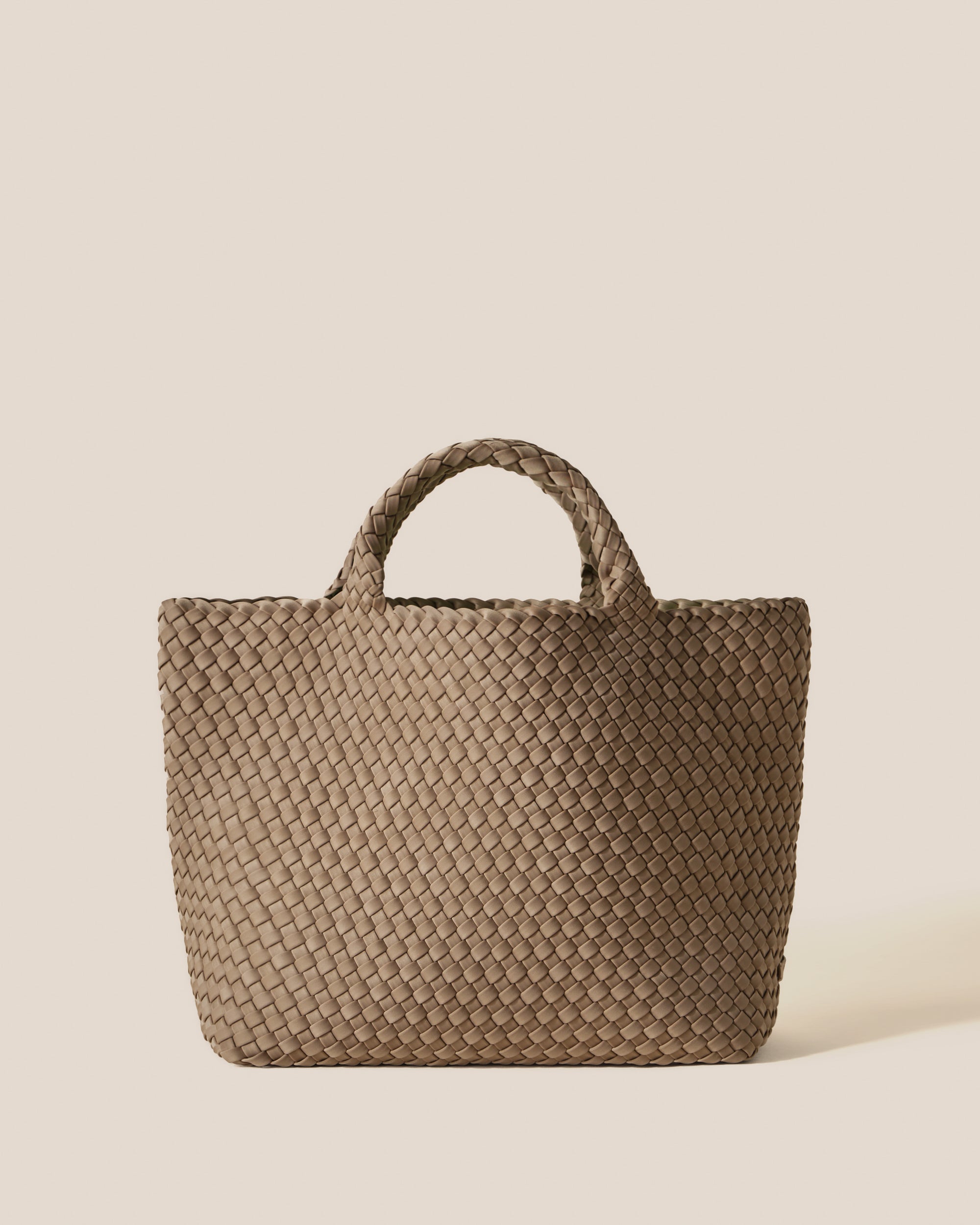 St. Barths Tote in Cashmere, a taupe tone, in handwoven neoprene, featuring an open top, and woven top handles.