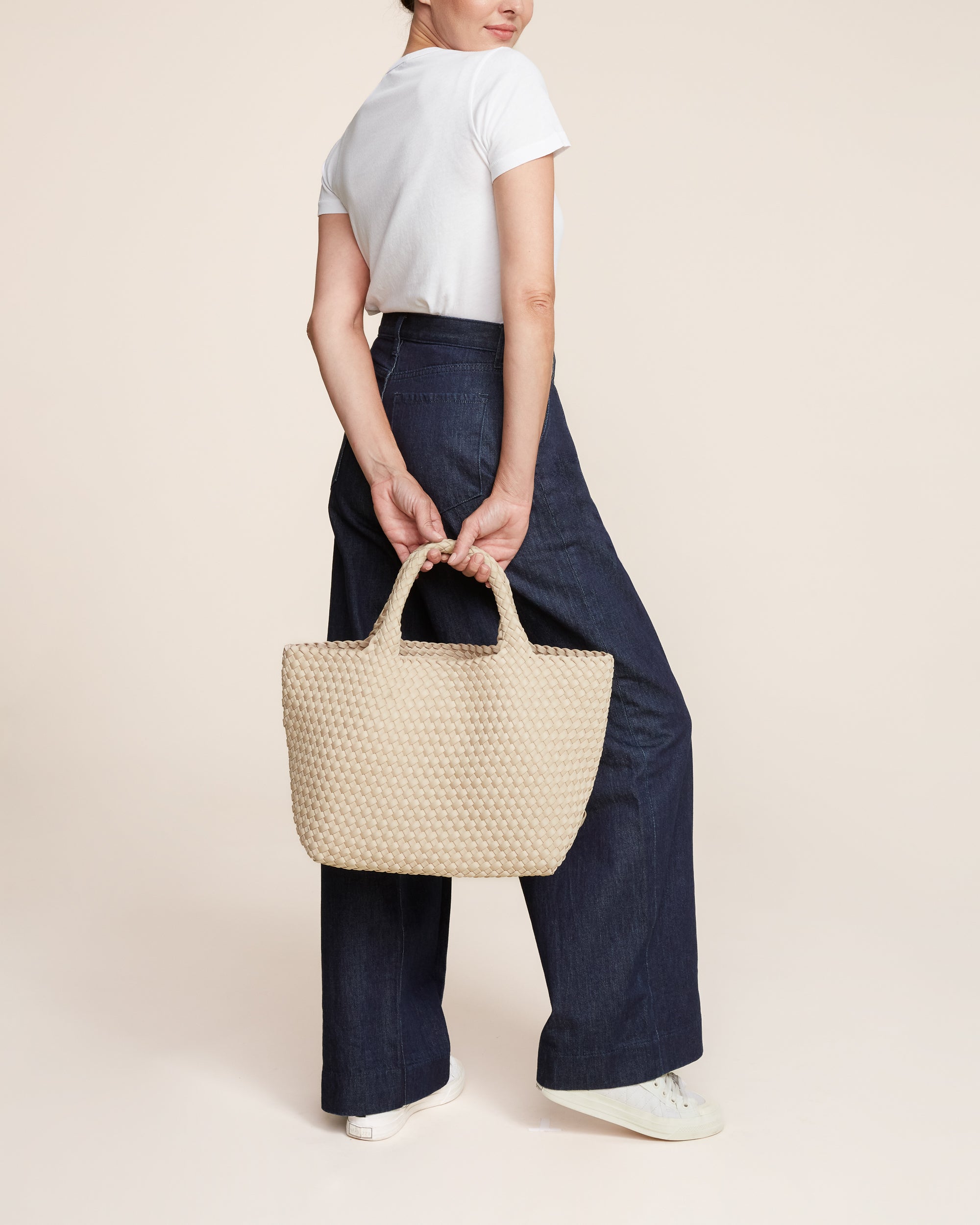 St. Barths Tote in Ecru shown on model to illustrate scale and soft silhouette.