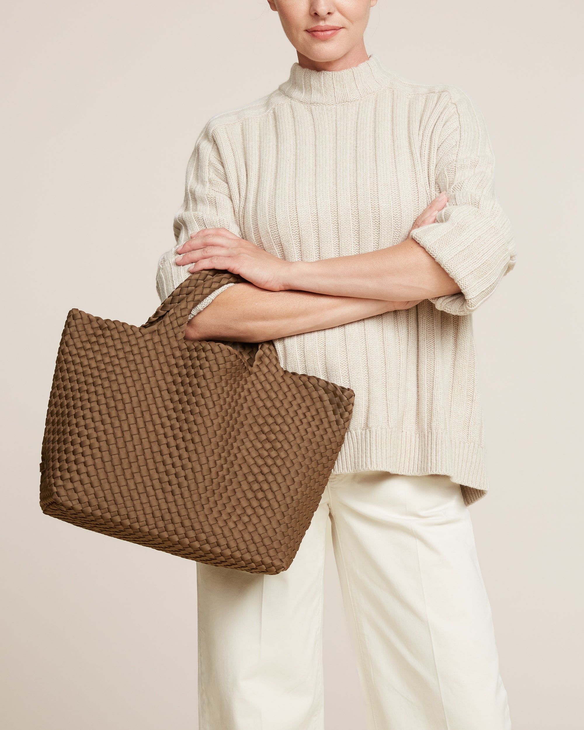 St. Barths Tote in Mink shown on model to illustrate scale and soft silhouette.