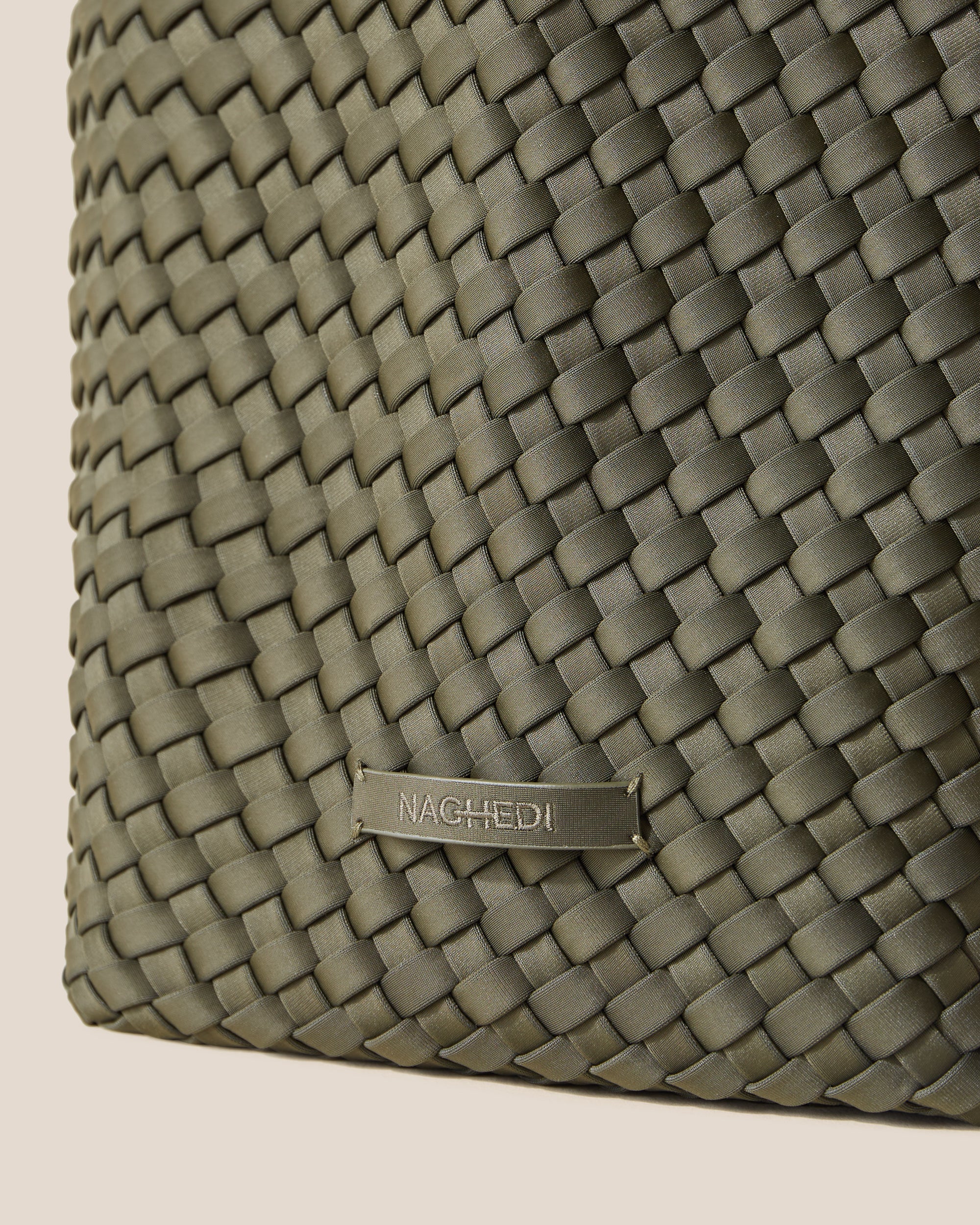 Close-up of stamped NAGHEDI logo on St. Barths Tote in Olive.