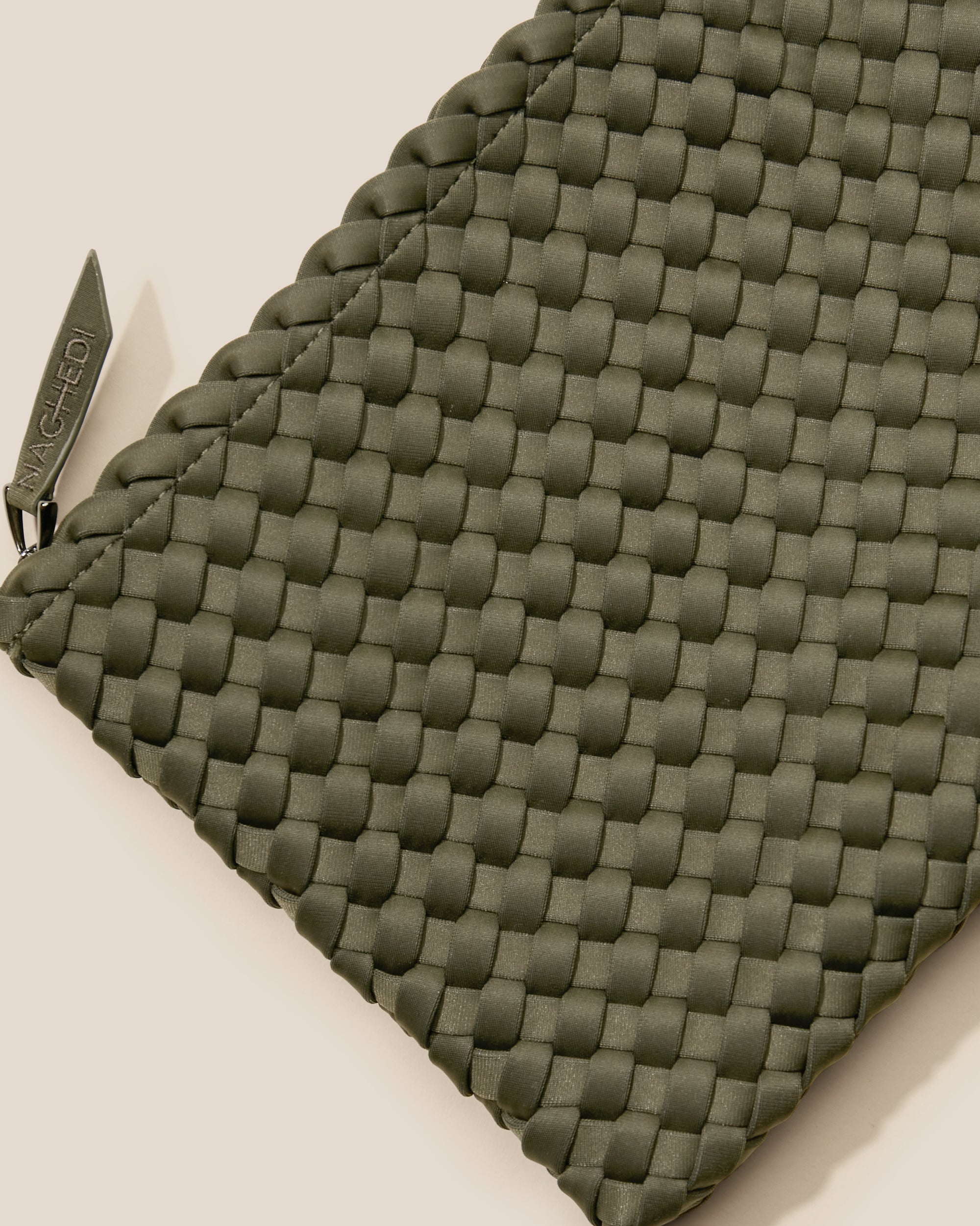 Close-up of included matching woven zippered pouch.