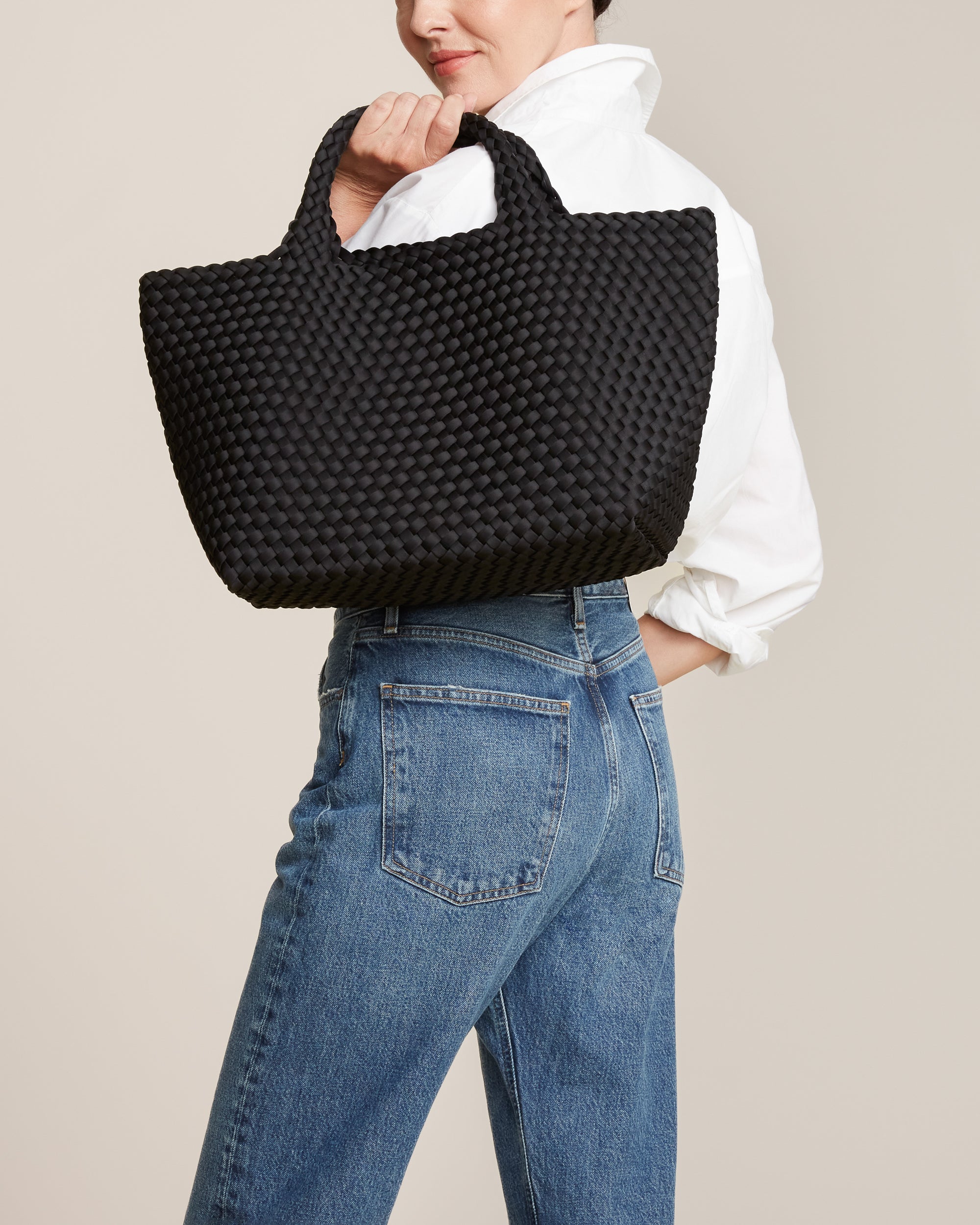 St. Barths Tote in Onyx shown on model to illustrate scale and soft silhouette.