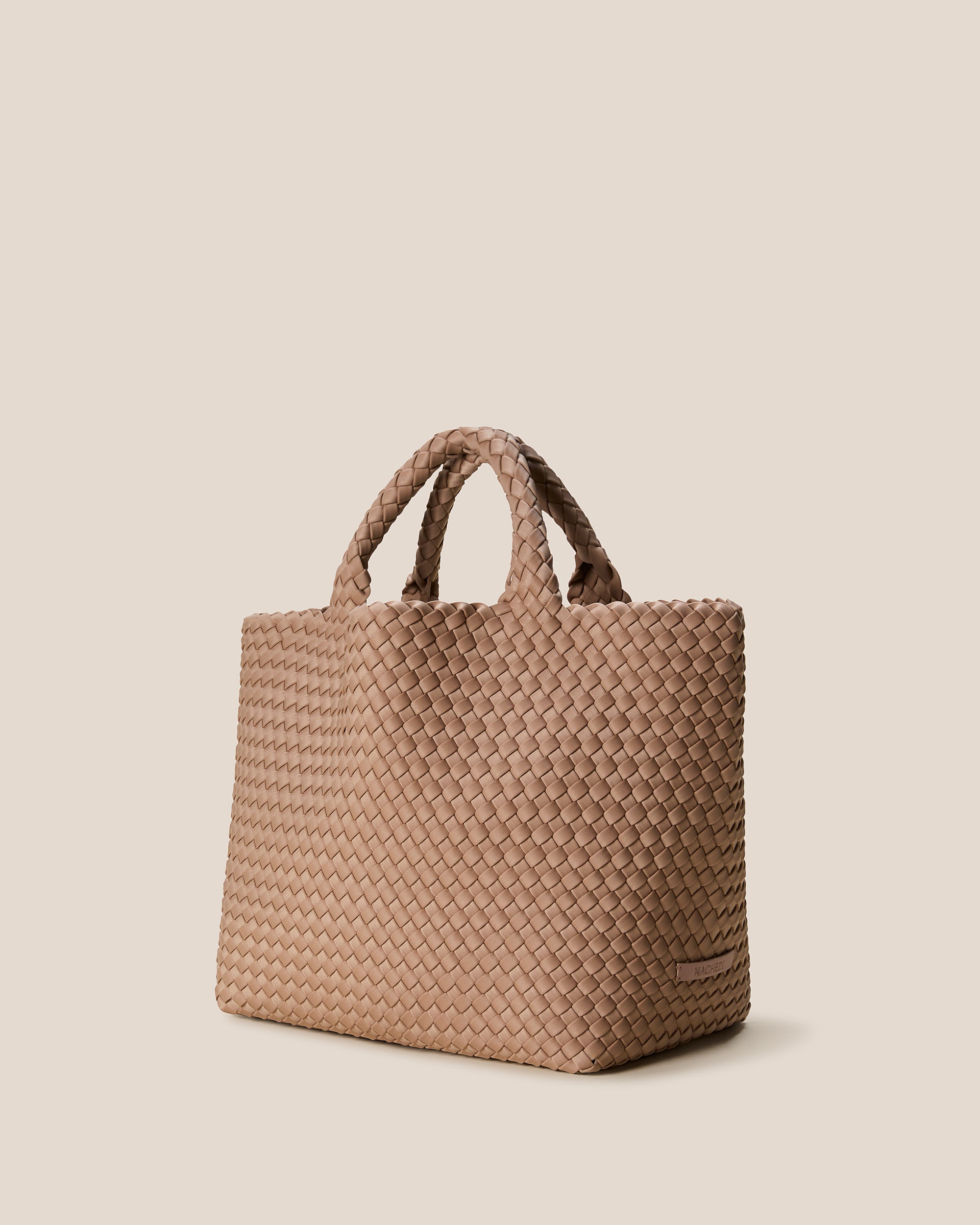 St. Barths Tote in Seychelles shown from a side angle, highlighting its handwoven neoprene construction and open top.