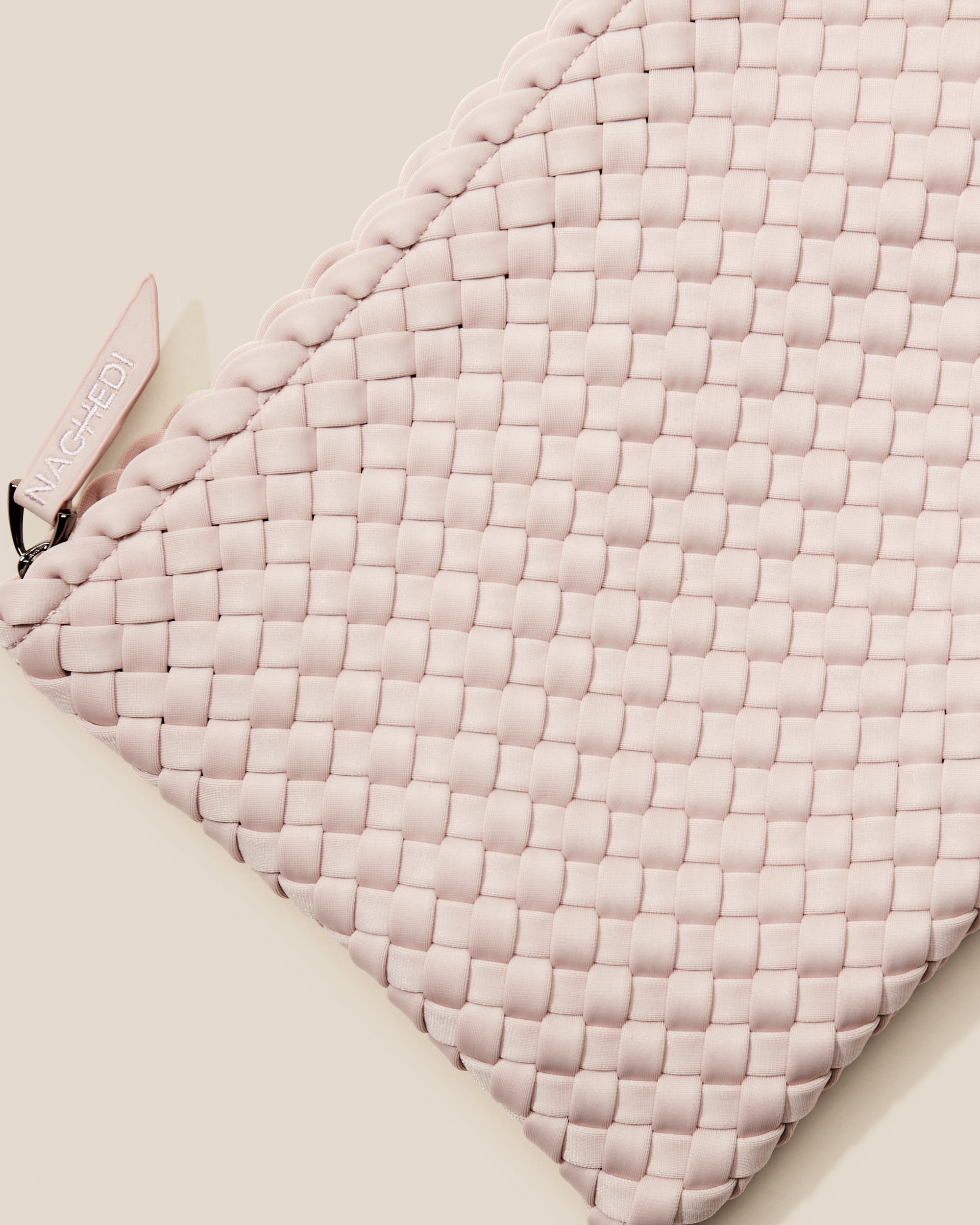 Close-up of included matching woven zippered pouch.