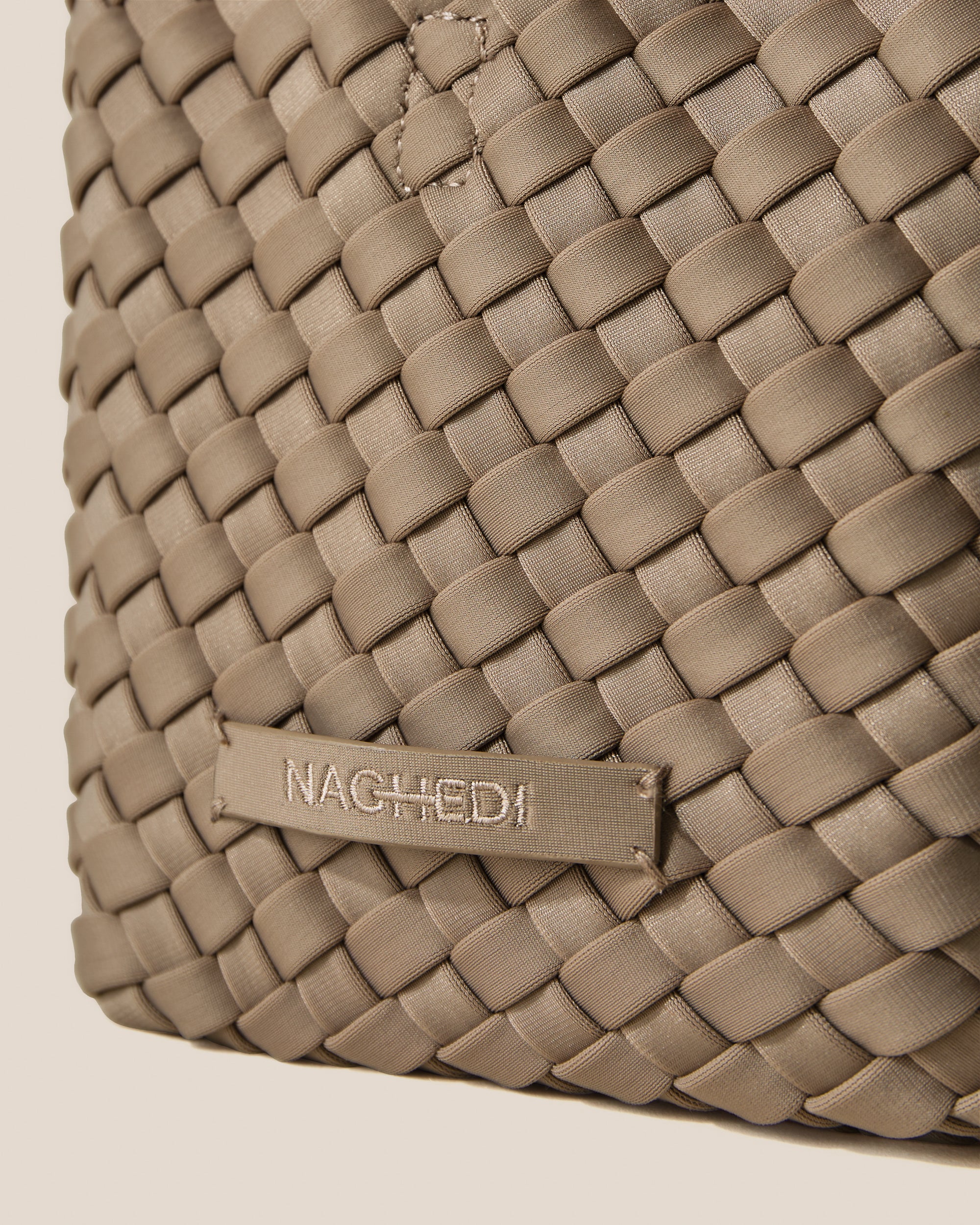 Close-up of stamped NAGHEDI logo on St. Barths Tote in Cashmere.