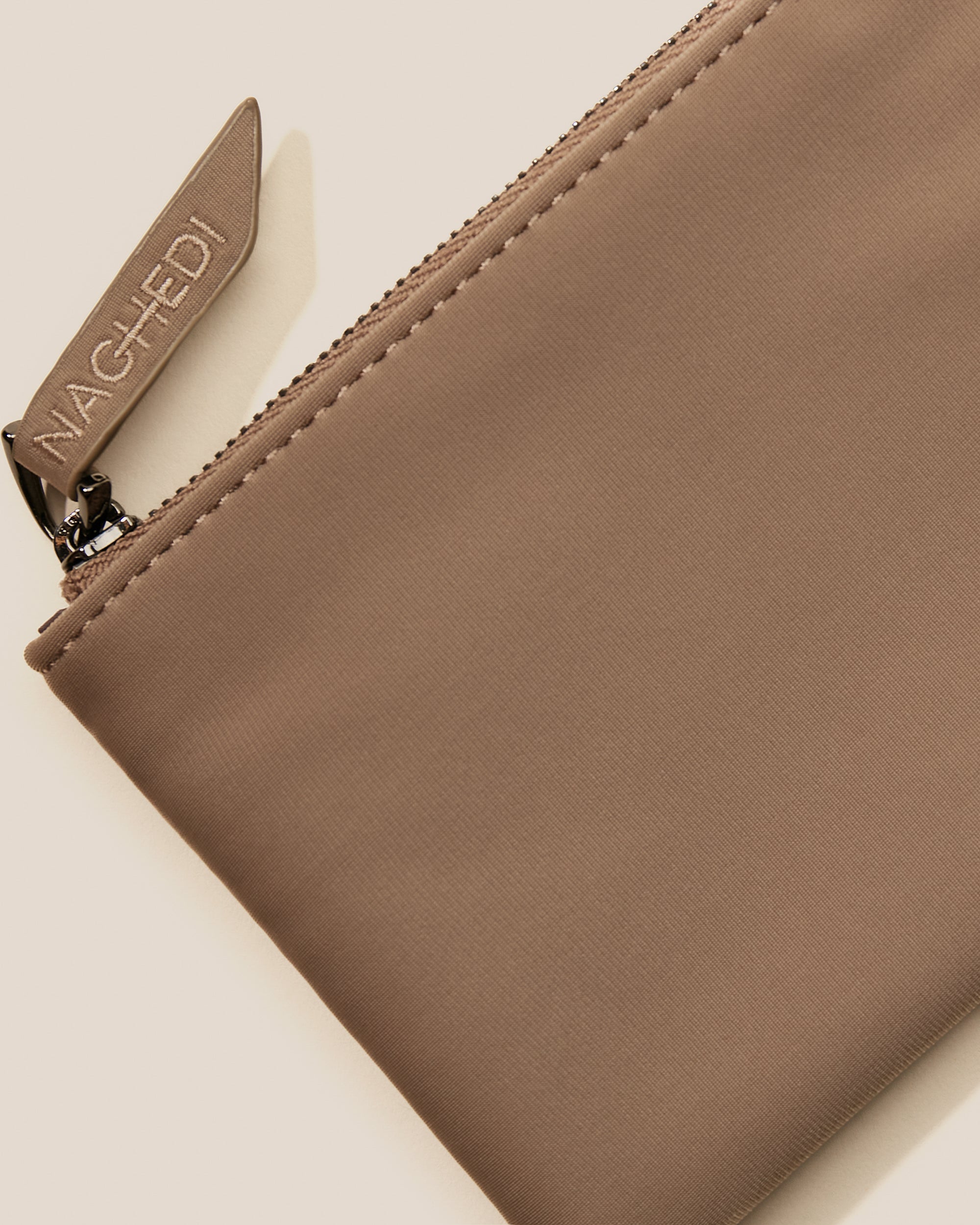 Close-up of included coordinating neoprene zippered pouch.