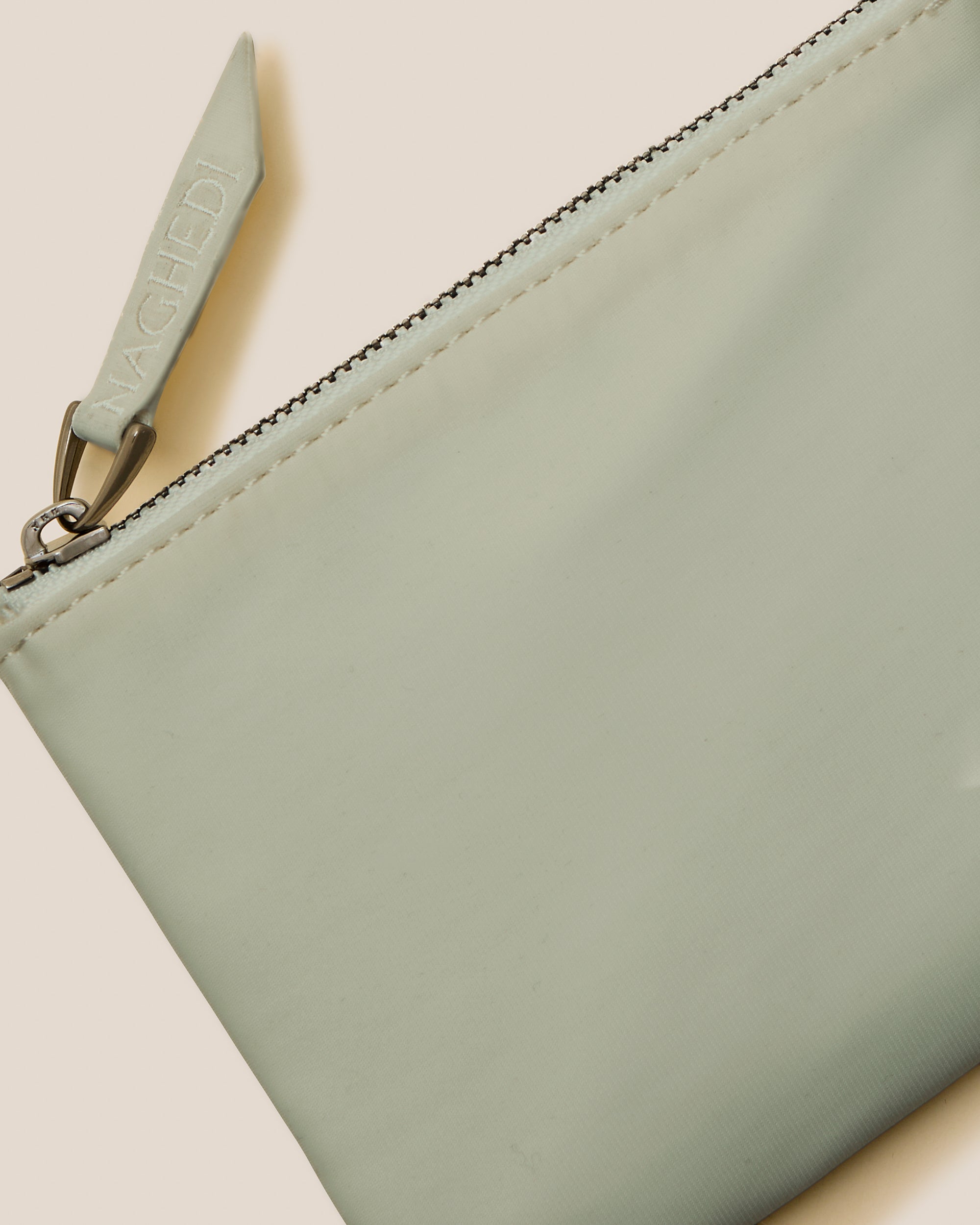 Close-up of included coordinating neoprene zippered pouch.