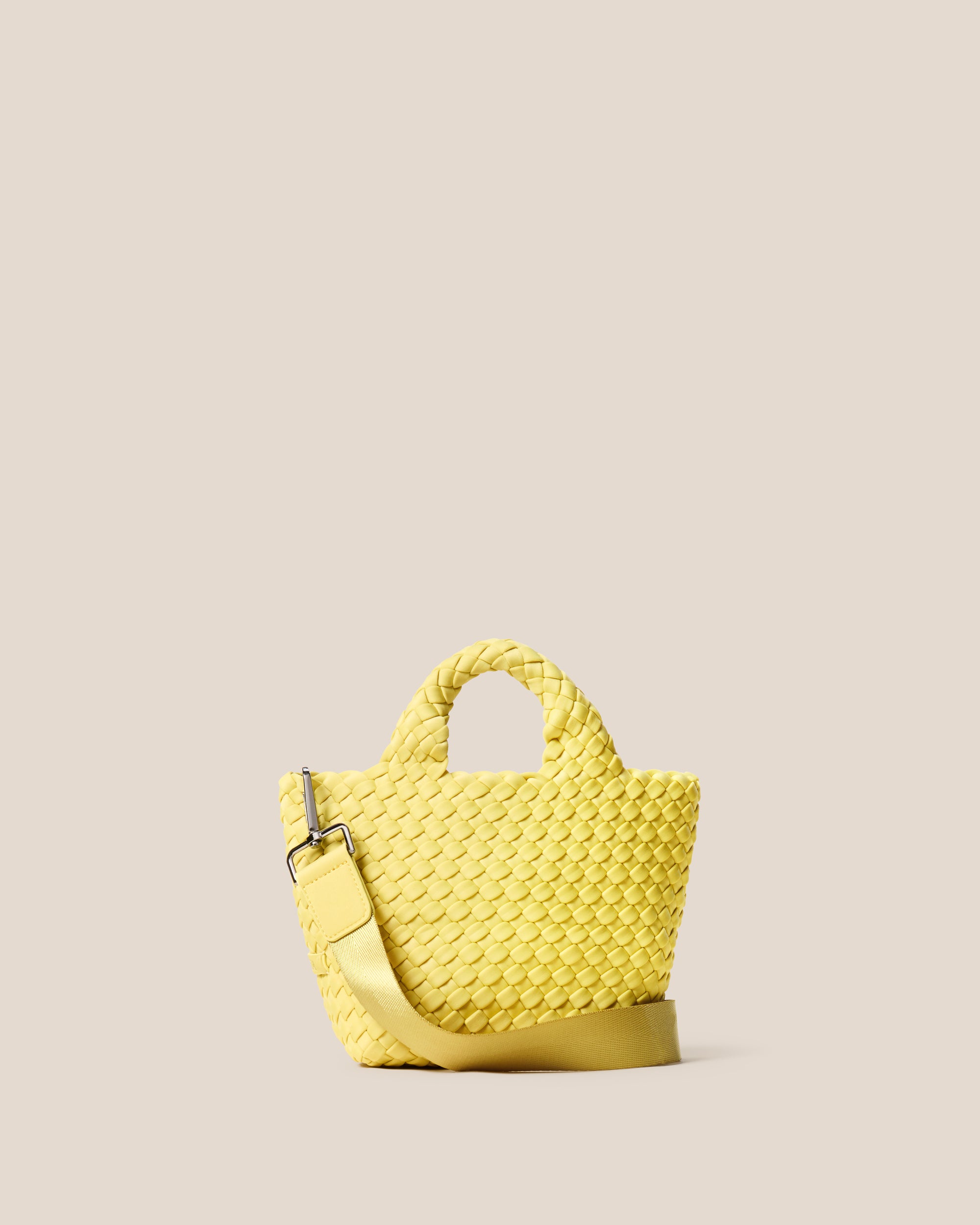 St. Barths Tote in Citron, a yellow tone, in handwoven neoprene, featuring an open top, woven top handles, and detachable, adjustable nylon crossbody strap.