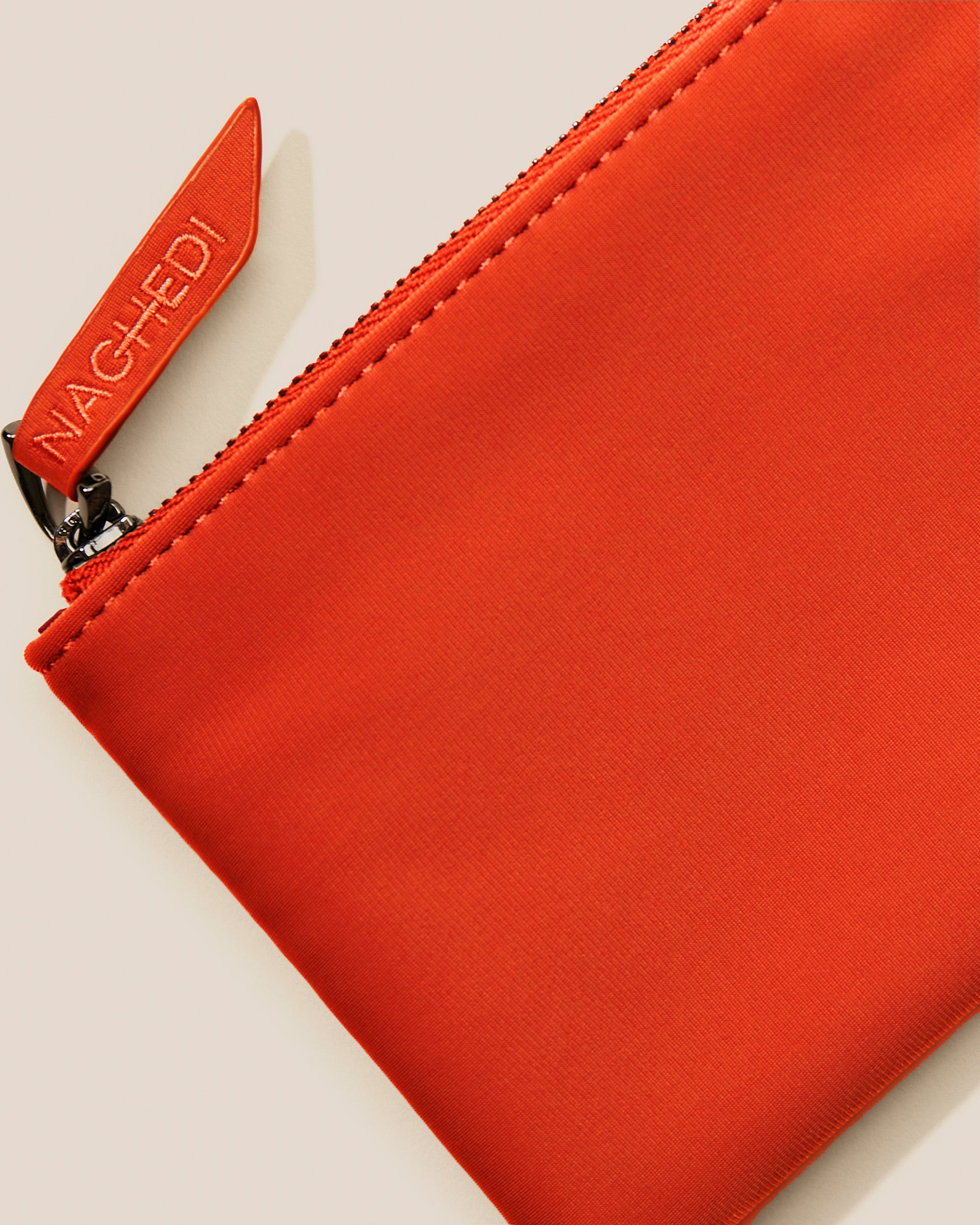 Close-up of included coordinating neoprene zippered pouch.