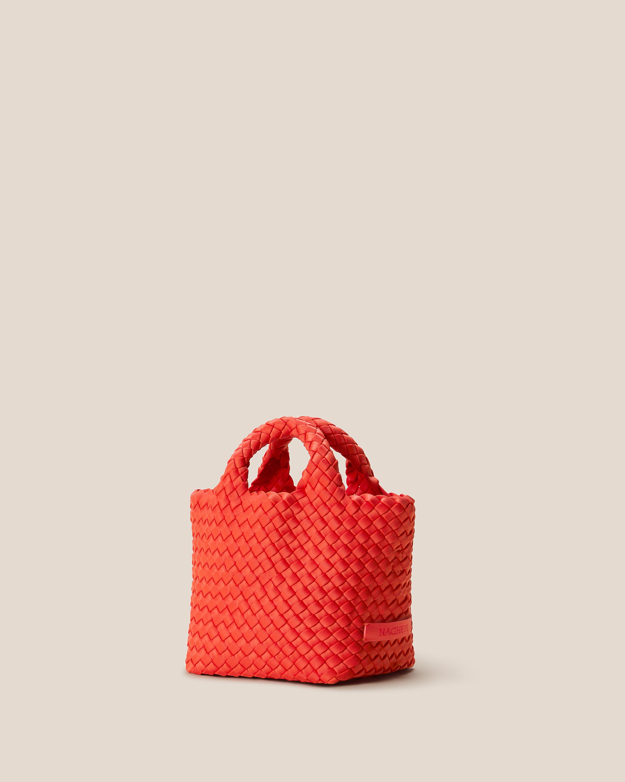 St. Barths Tote in Ipanema shown from a side angle, highlighting its handwoven neoprene construction and open top.
