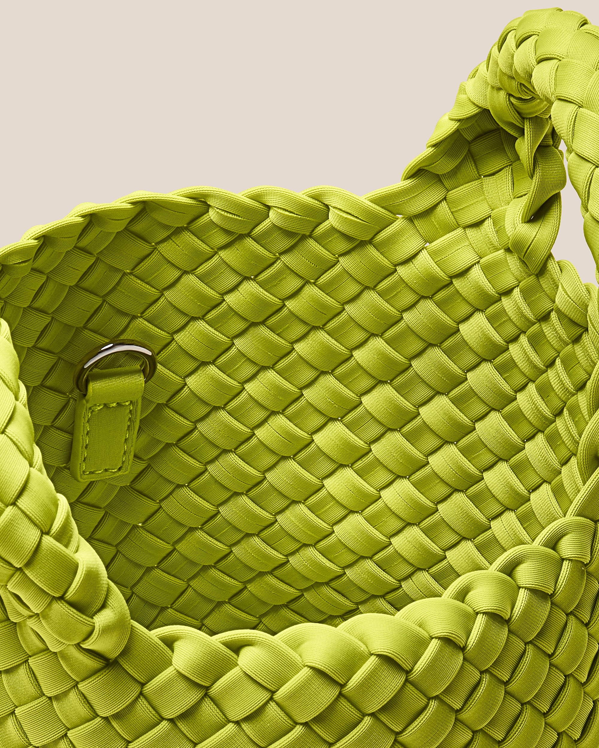 Interior close-up of St. Barths Tote in Matcha showing its open top, and unlined interior.