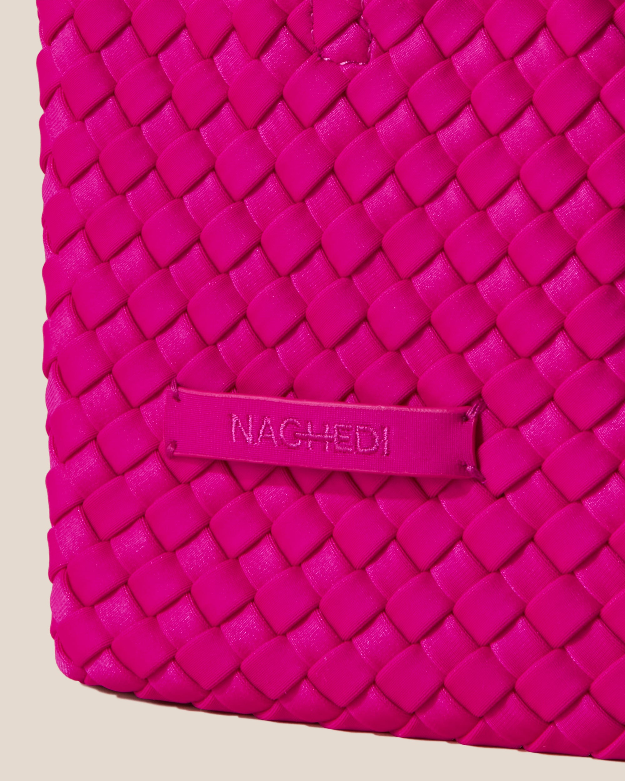 Close-up of stamped NAGHEDI logo on St. Barths Tote in Miami Pink.