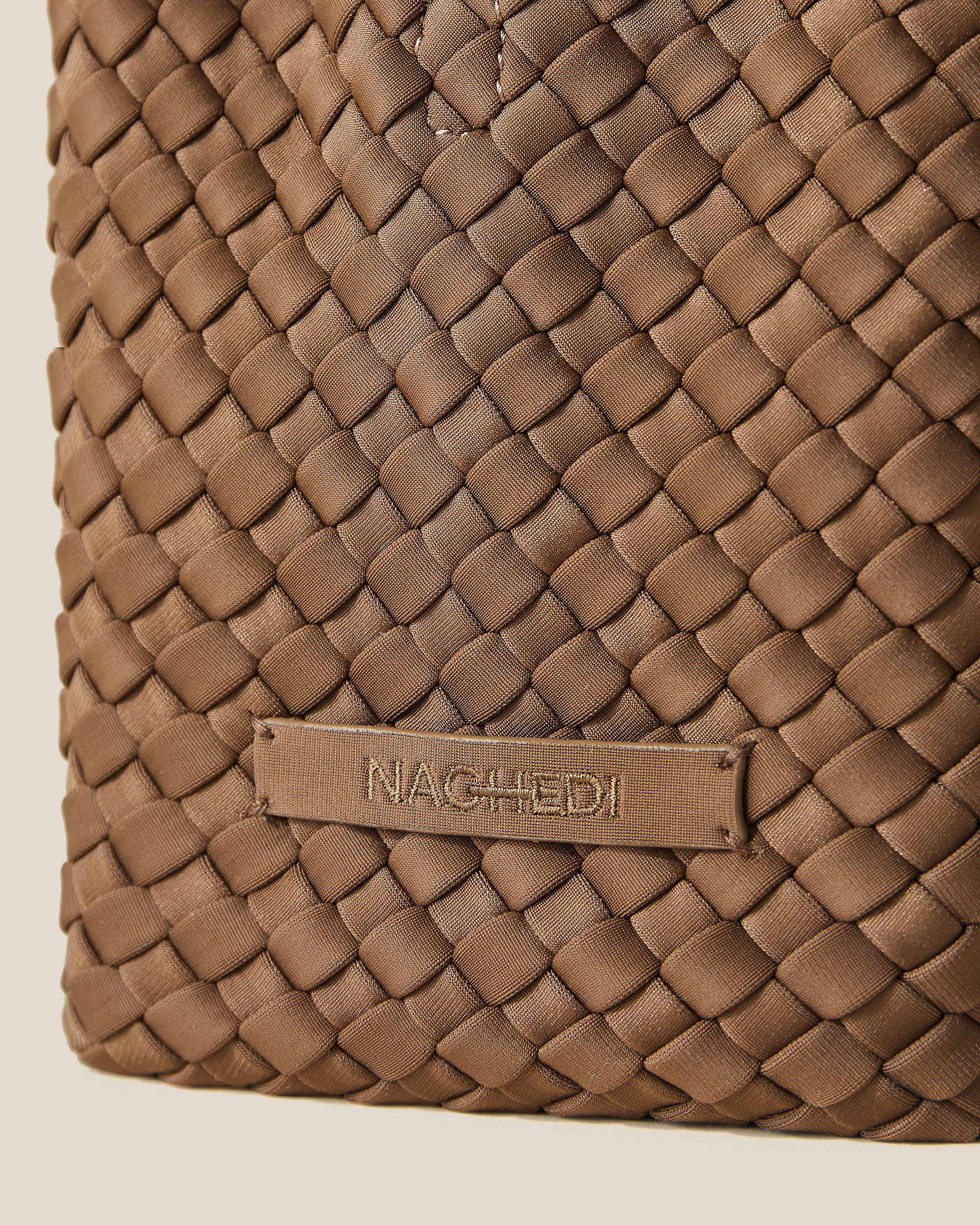 Close-up of stamped NAGHEDI logo on St. Barths Tote in Mink.