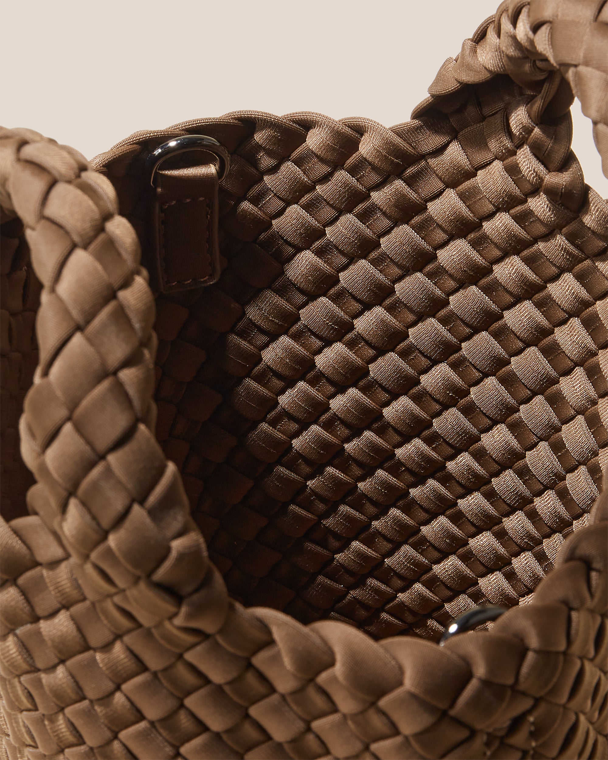 Interior close-up of St. Barths Tote in Mink showing its open top, and unlined interior.