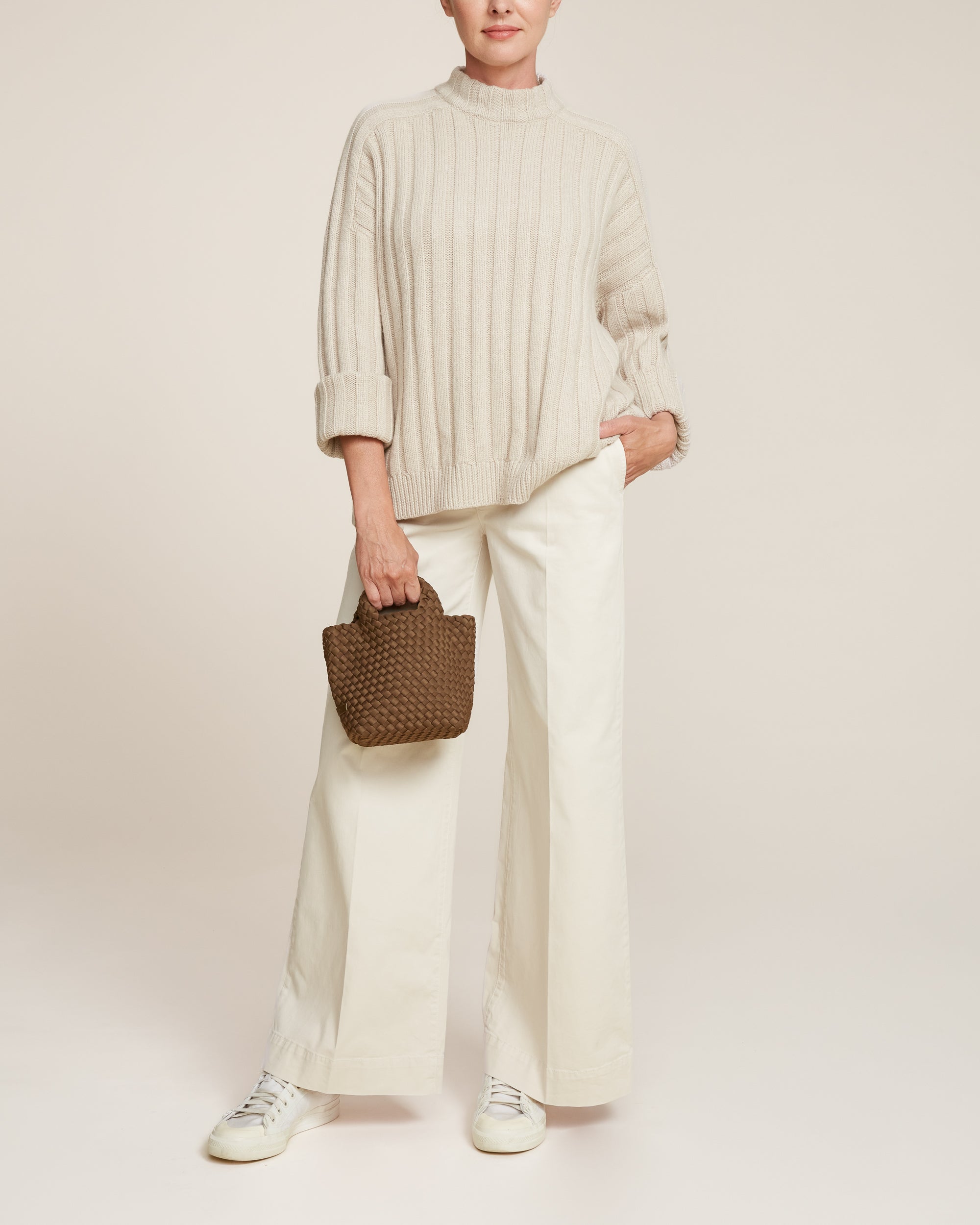 St. Barths Tote in Mink shown on model to illustrate scale and soft silhouette.