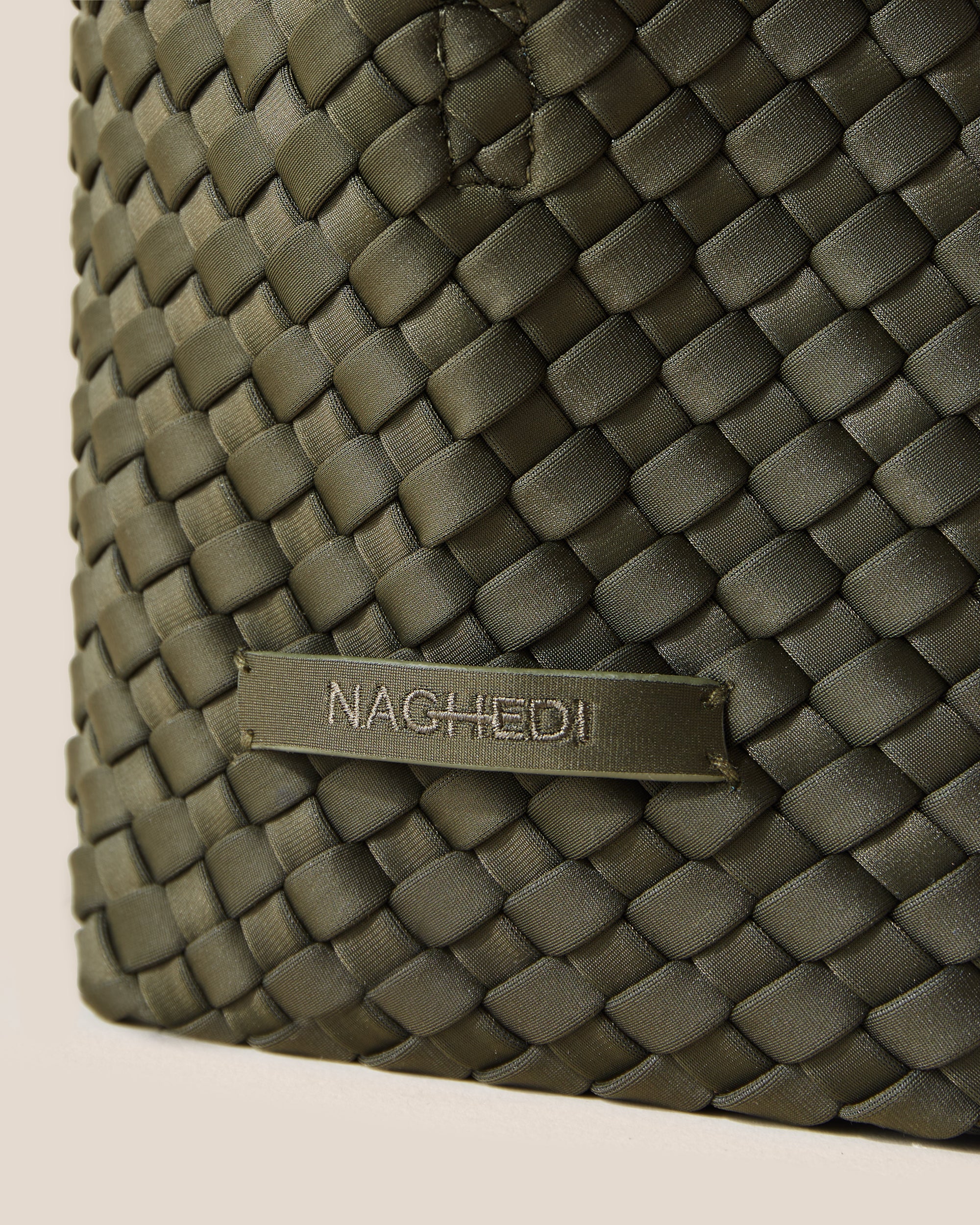 Close-up of stamped NAGHEDI logo on St. Barths Tote in Olive.