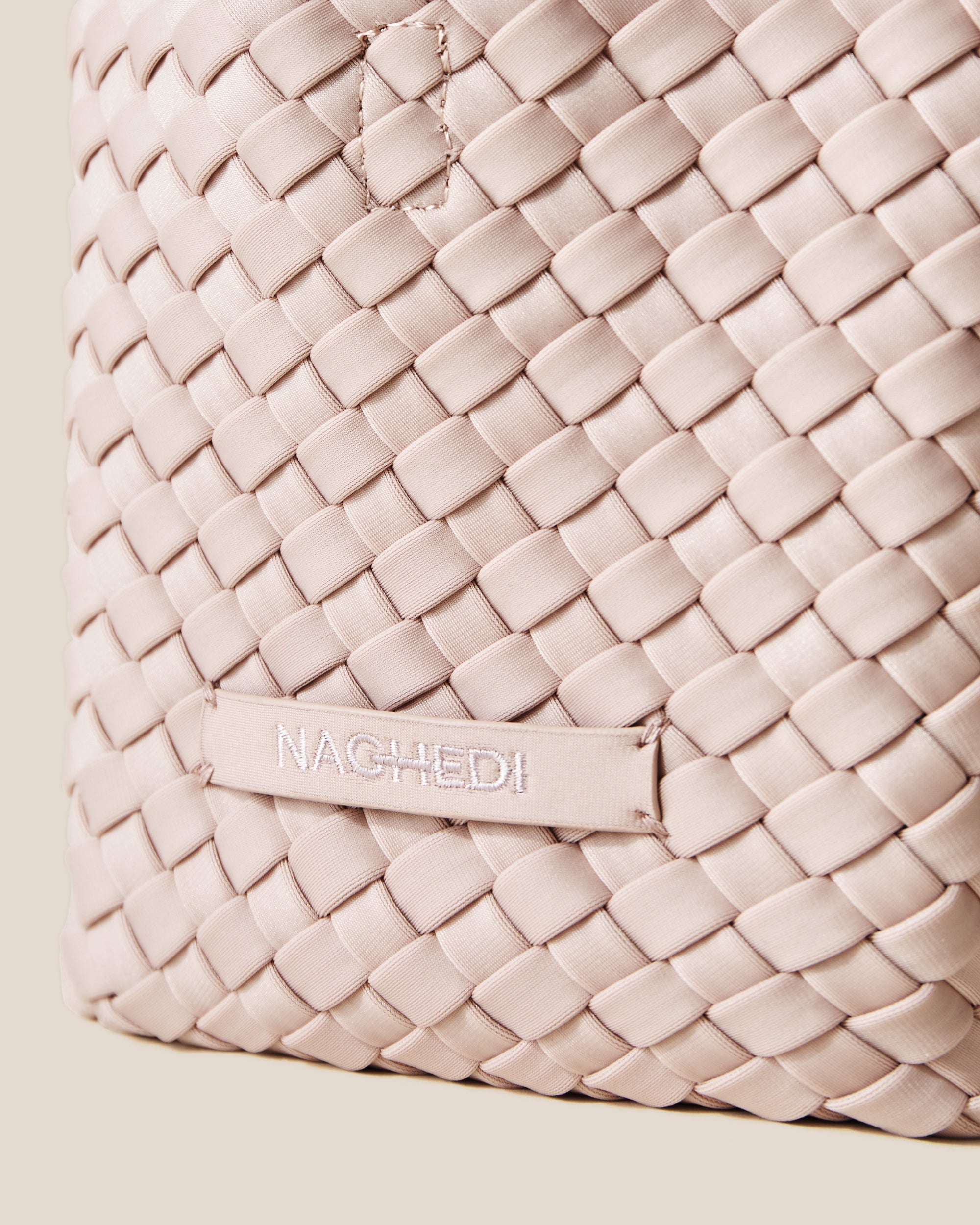 Close-up of stamped NAGHEDI logo on St. Barths Tote in Shell Pink.