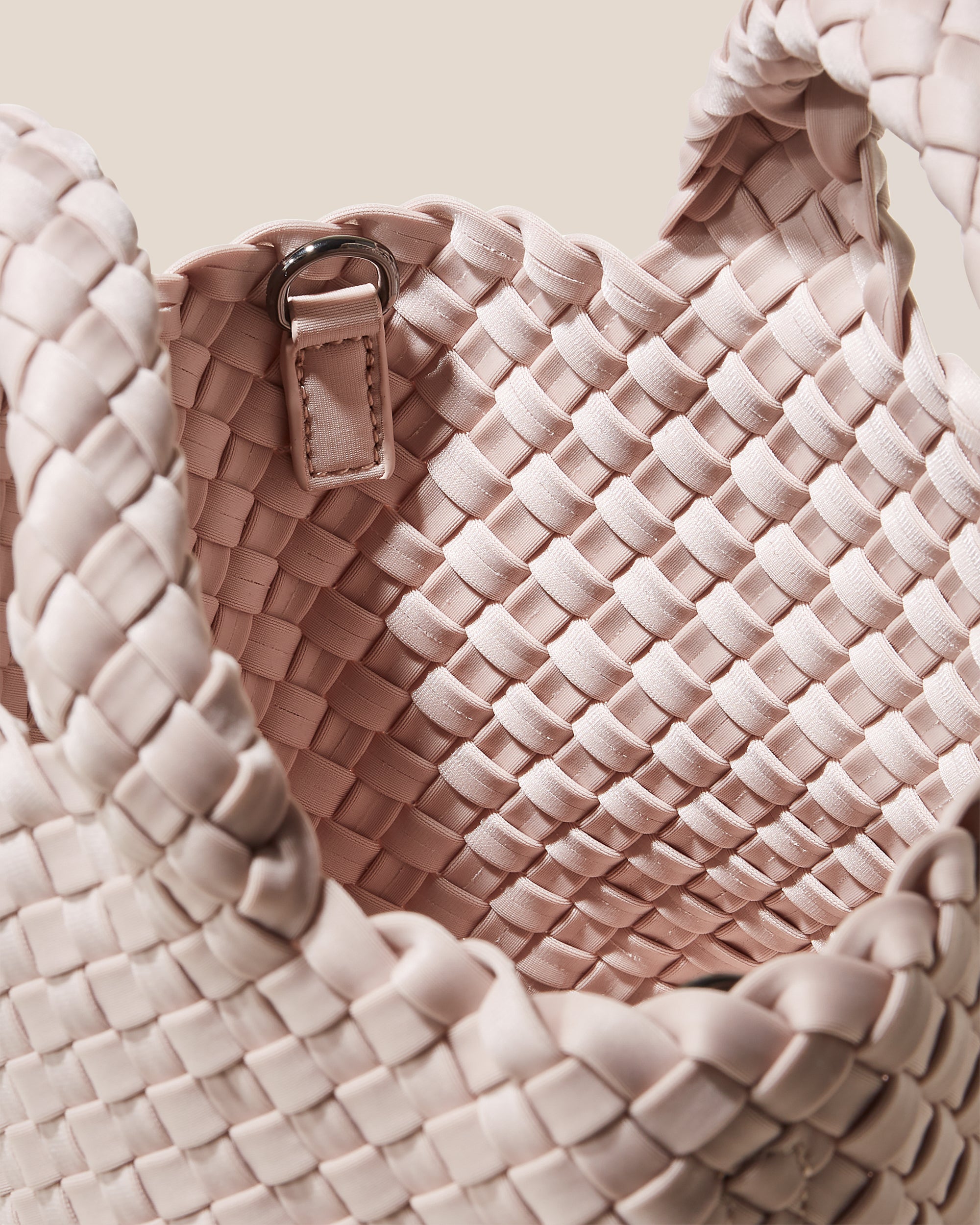 Interior close-up of St. Barths Tote in Shell Pink showing its open top, and unlined interior.