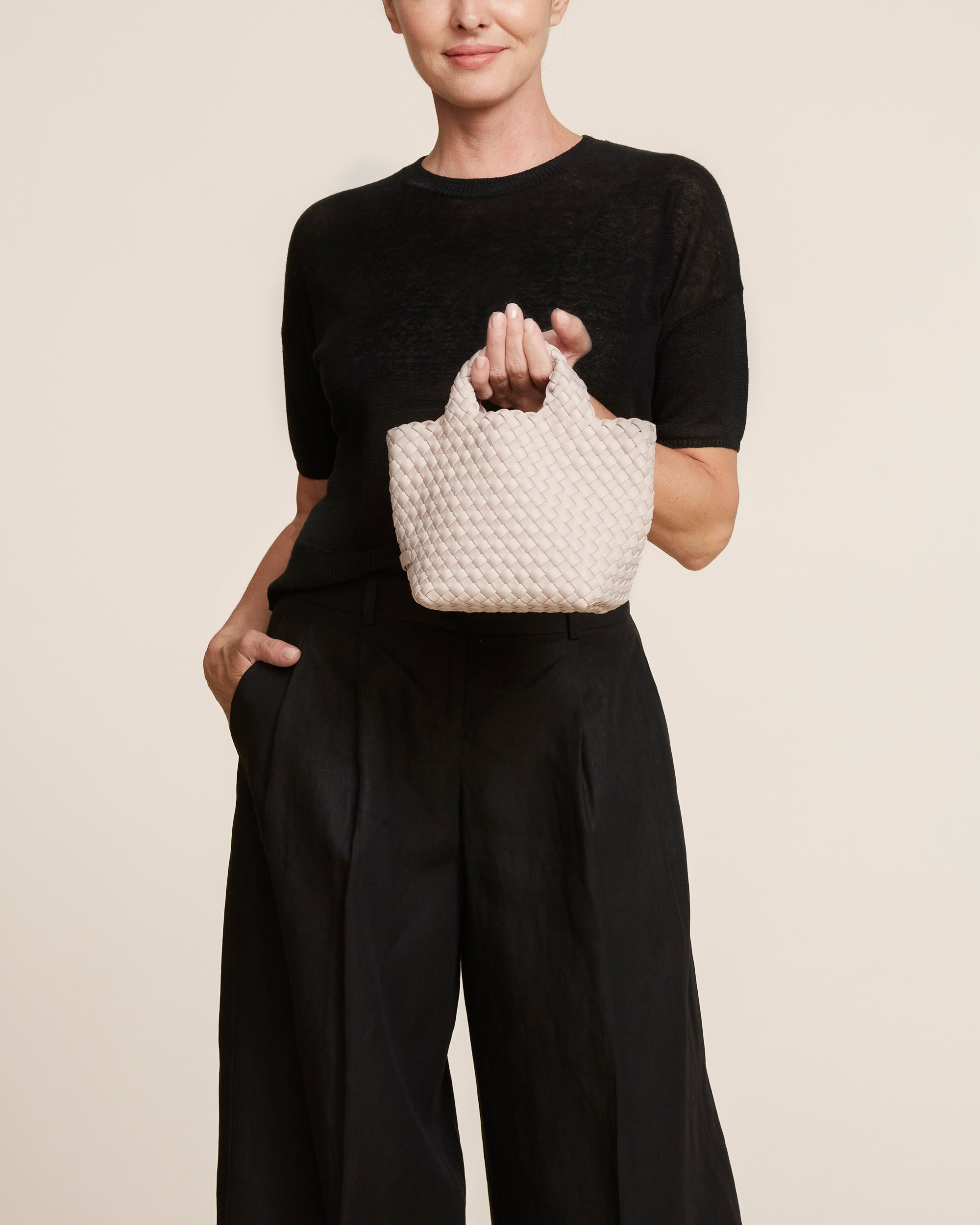 St. Barths Tote in Shell Pink shown on model to illustrate scale and soft silhouette.