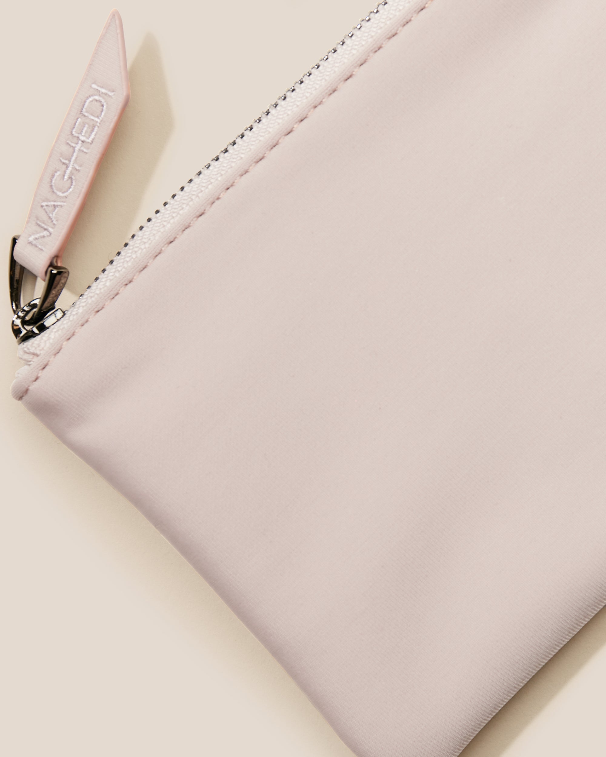 Close-up of included coordinating neoprene zippered pouch.