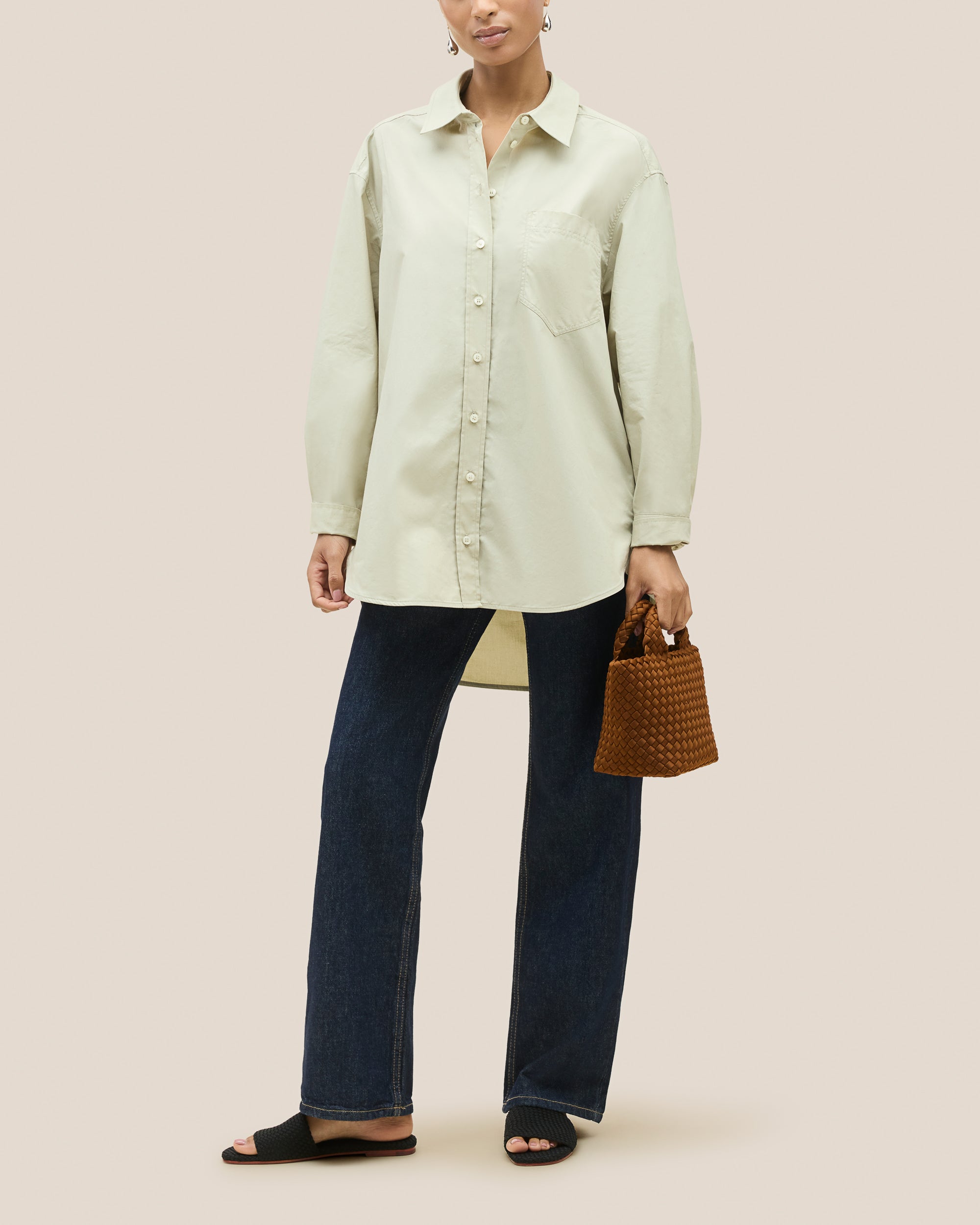 St. Barths Tote in Teak shown on model to illustrate scale and soft silhouette.