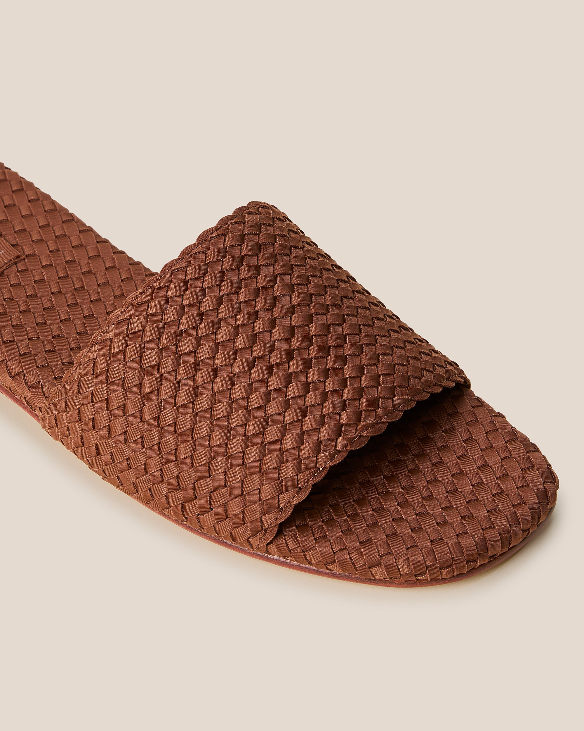 Close-up of The St. Barths Slide in Adobe showing its open toe and square silhouette.