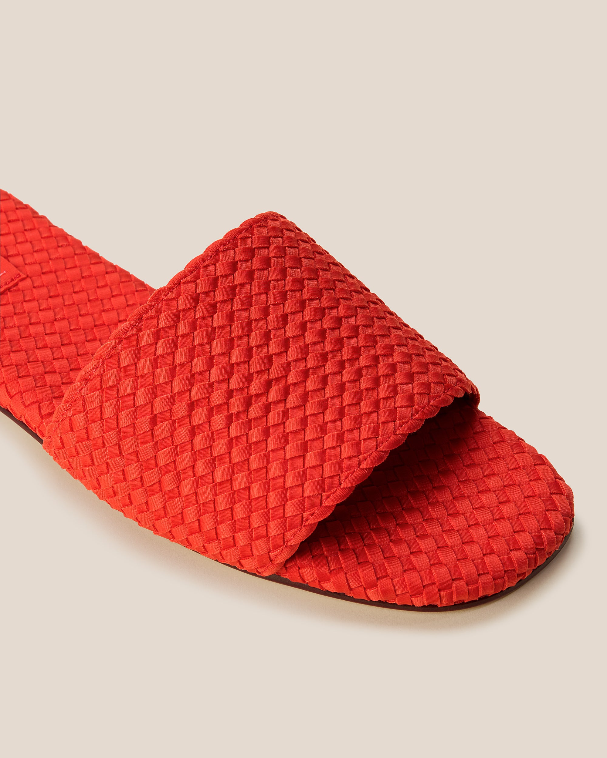Close-up of The St. Barths Slide in Ipanema showing its open toe and square silhouette.