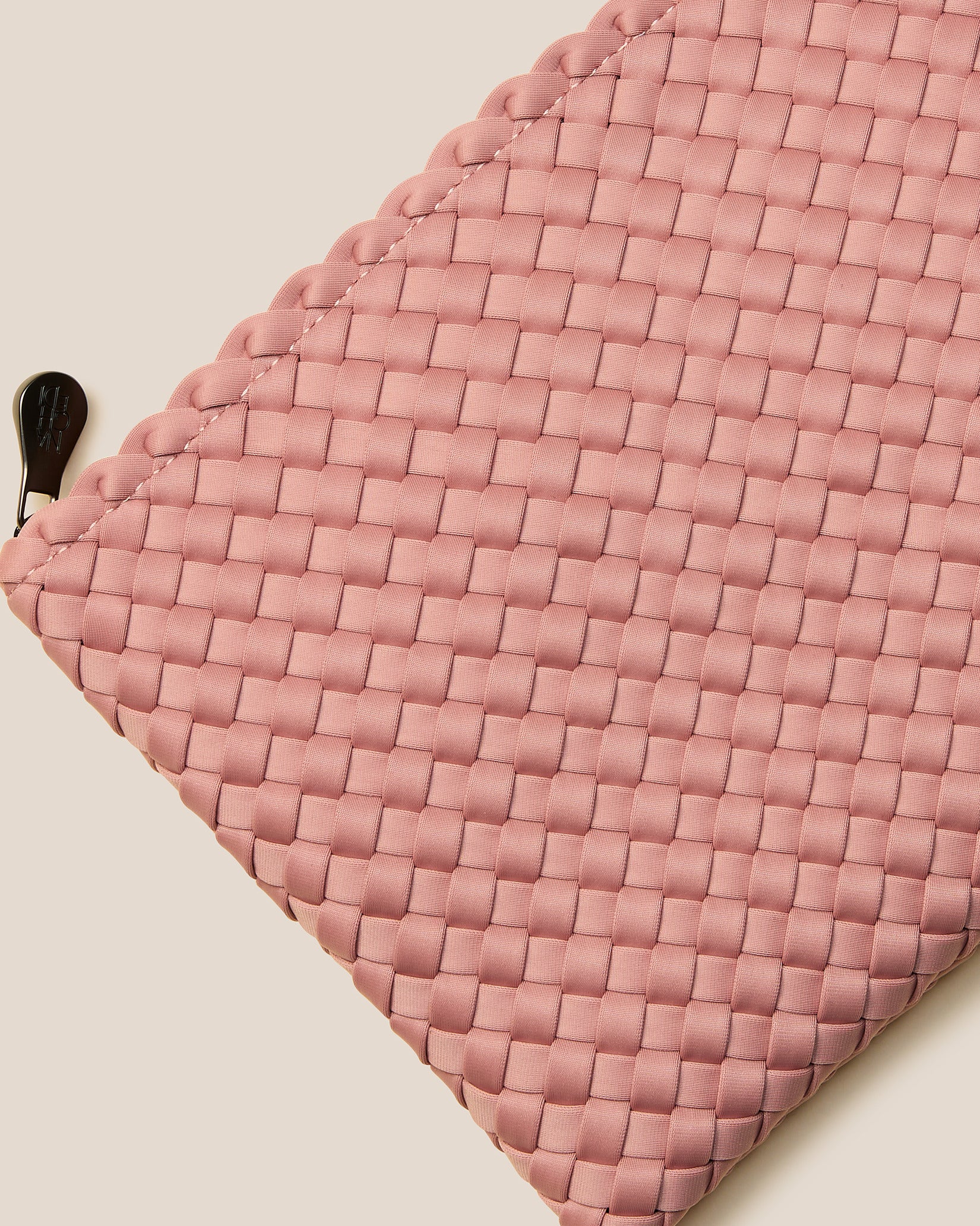 Close-up of included matching woven zippered pouch.