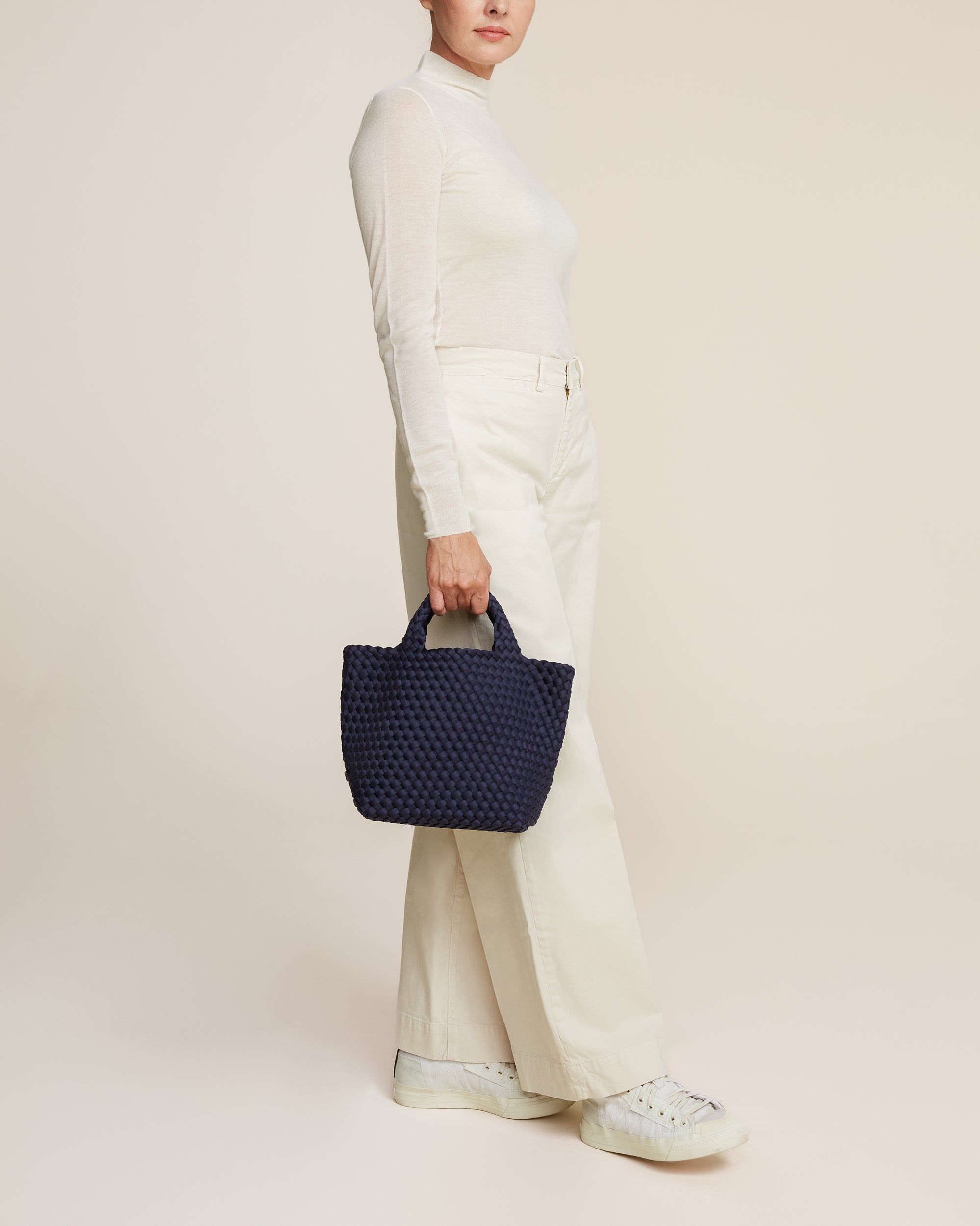 St. Barths Tote in Ink Blue shown on model to illustrate scale and soft silhouette.
