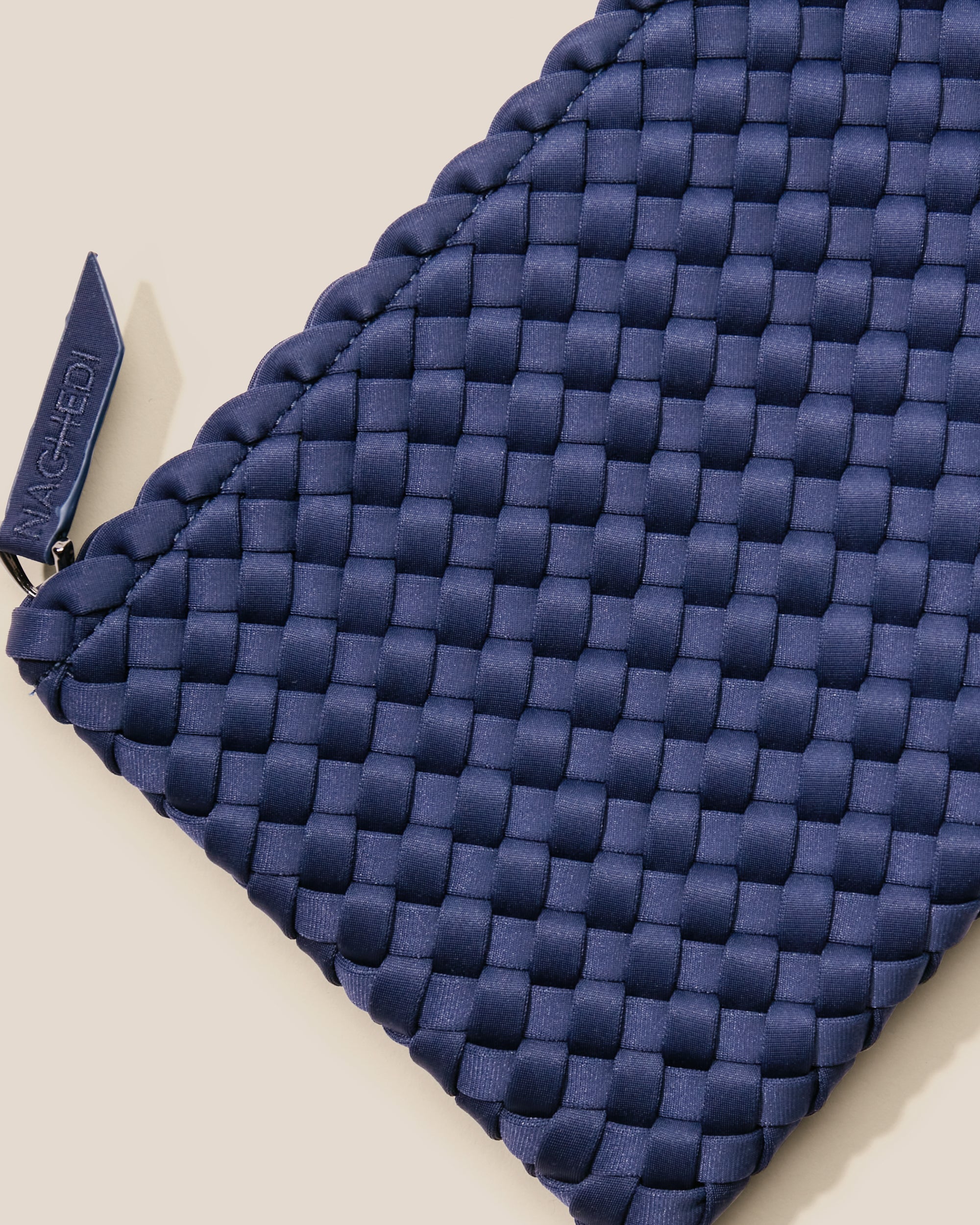 Close-up of included matching woven zippered pouch.