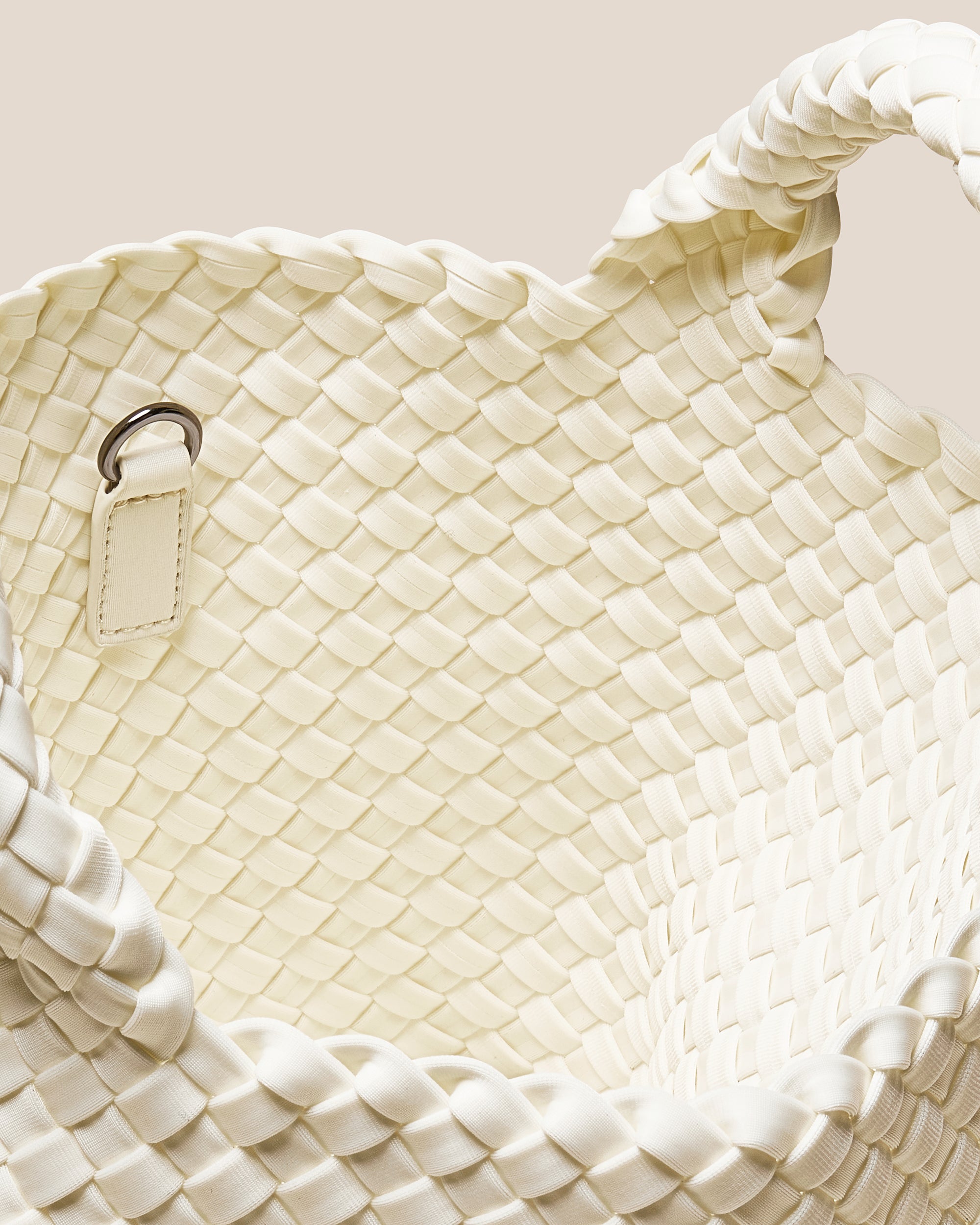 Interior close-up of St. Barths Tote in Jasmine showing its open top, and unlined interior.