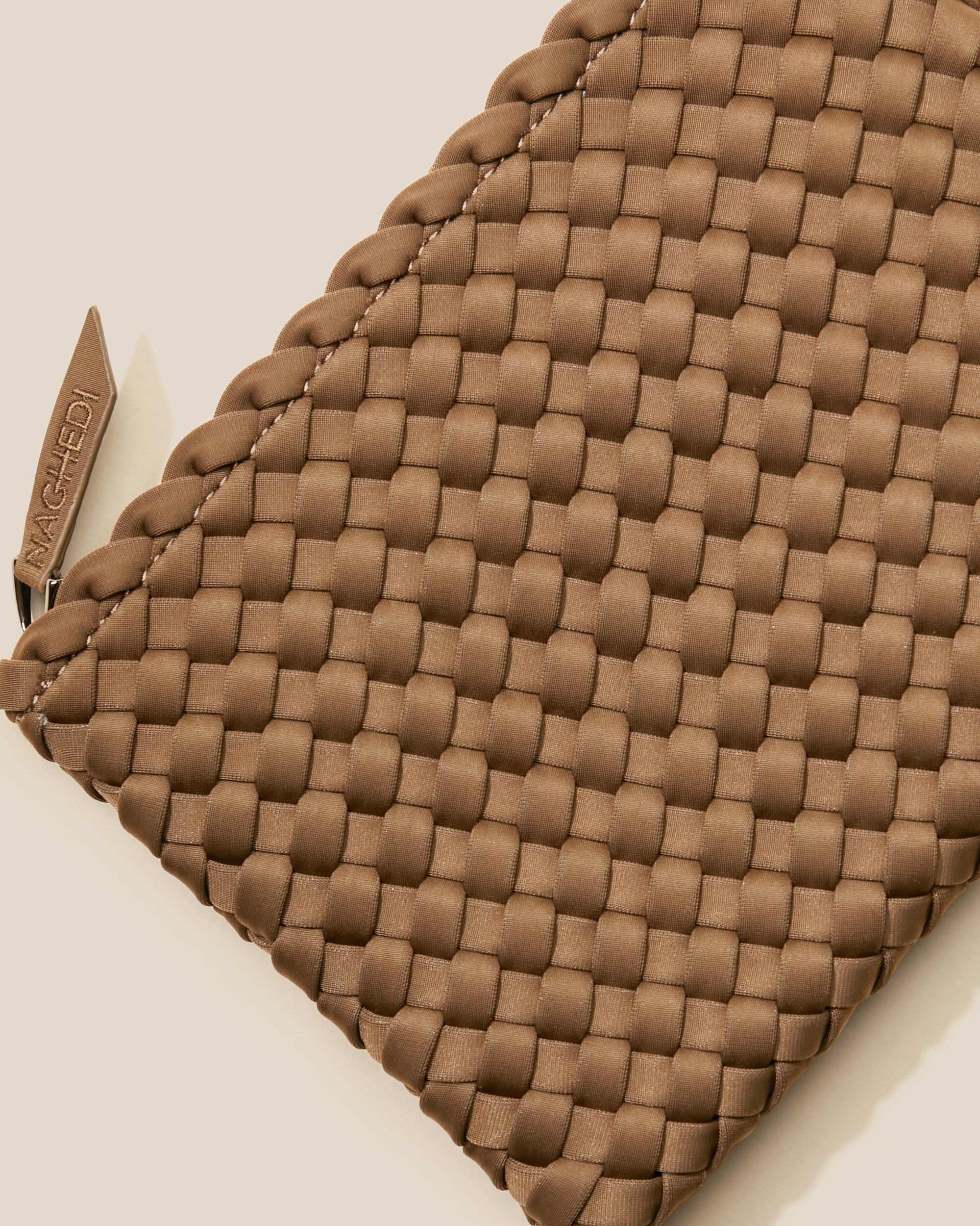 Close-up of included matching woven zippered pouch.