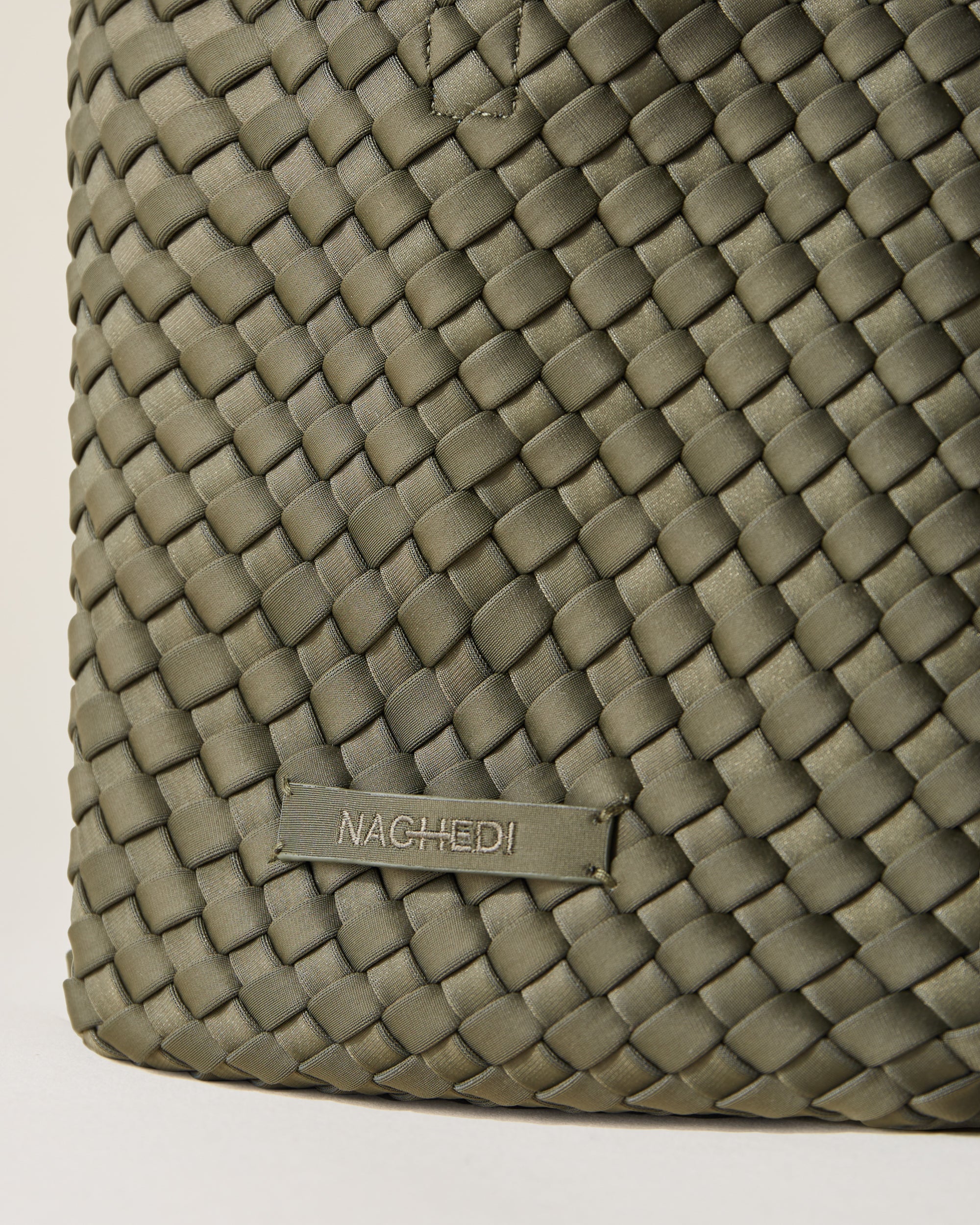 Close-up of stamped NAGHEDI logo on St. Barths Tote in Olive.