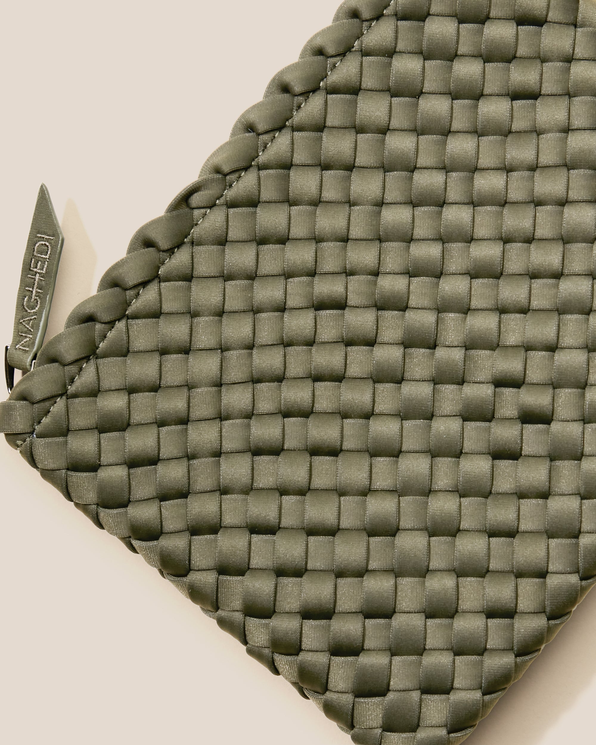 Close-up of included matching woven zippered pouch.