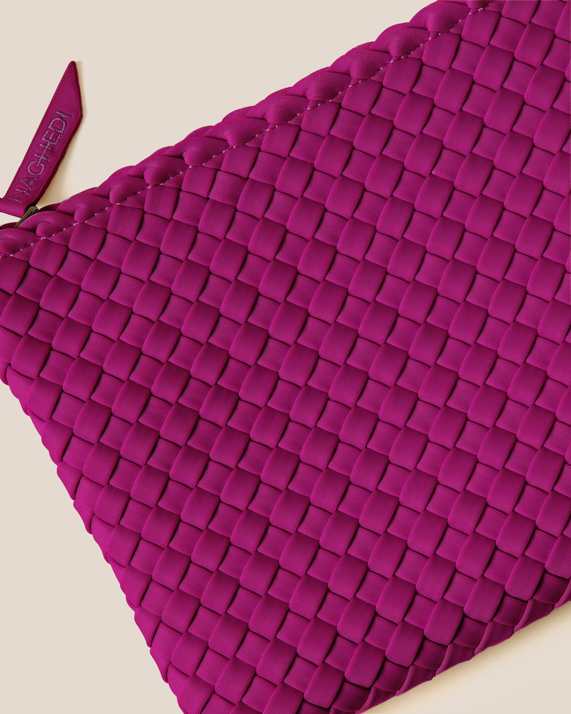 Close-up of included matching woven zippered pouch.