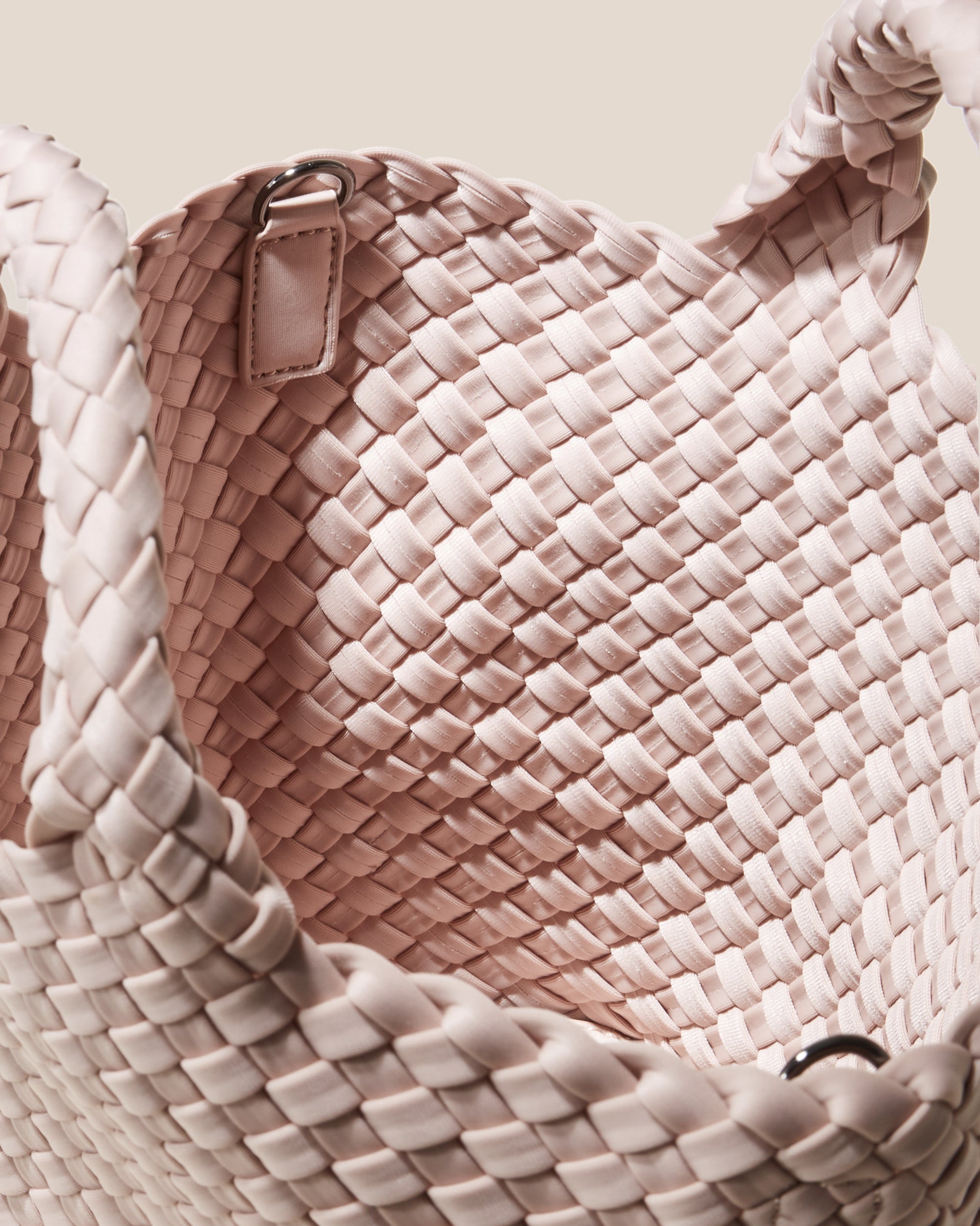 Interior close-up of St. Barths Tote in Shell Pink showing its open top, and unlined interior.