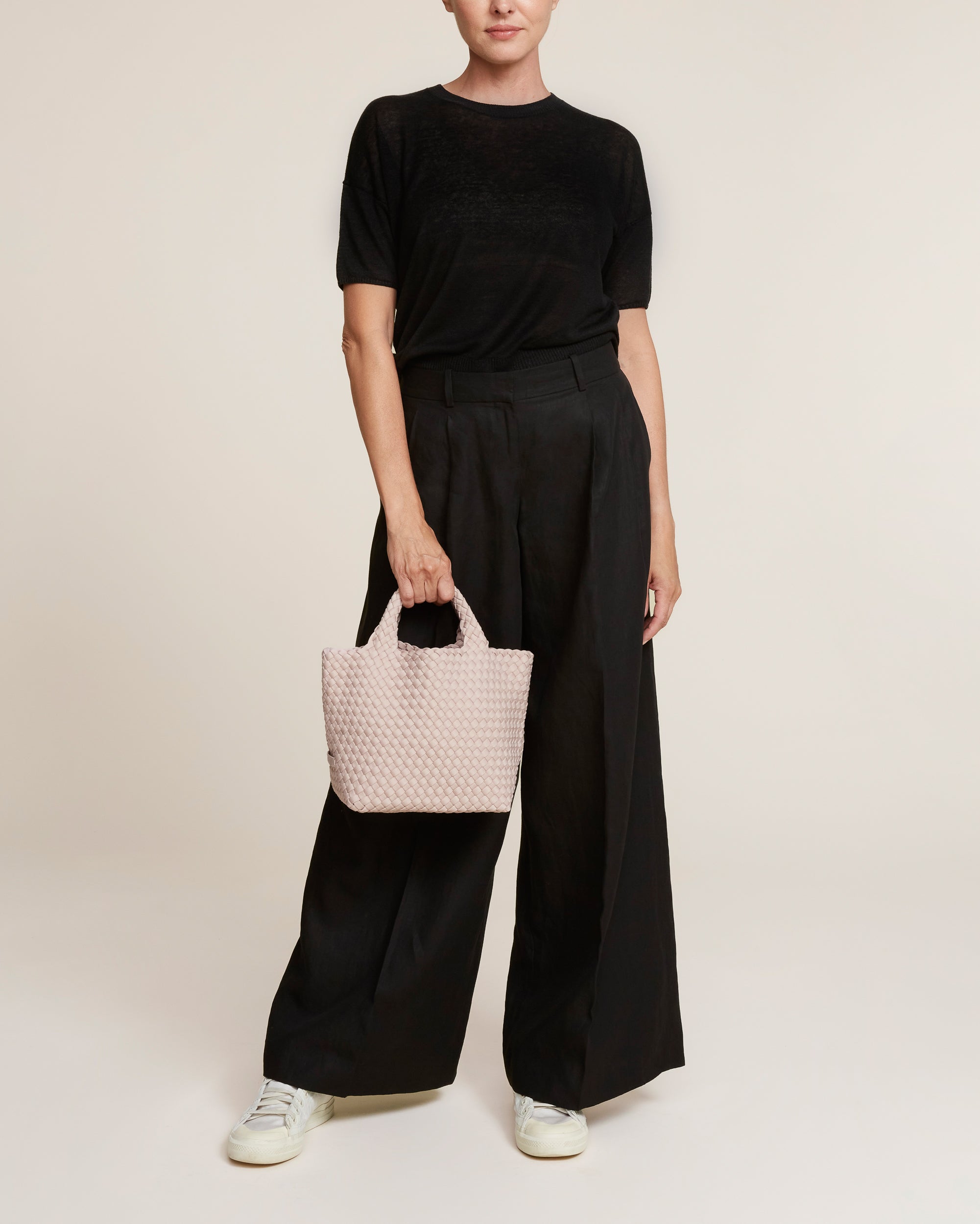 St. Barths Tote in Shell Pink shown on model to illustrate scale and soft silhouette.