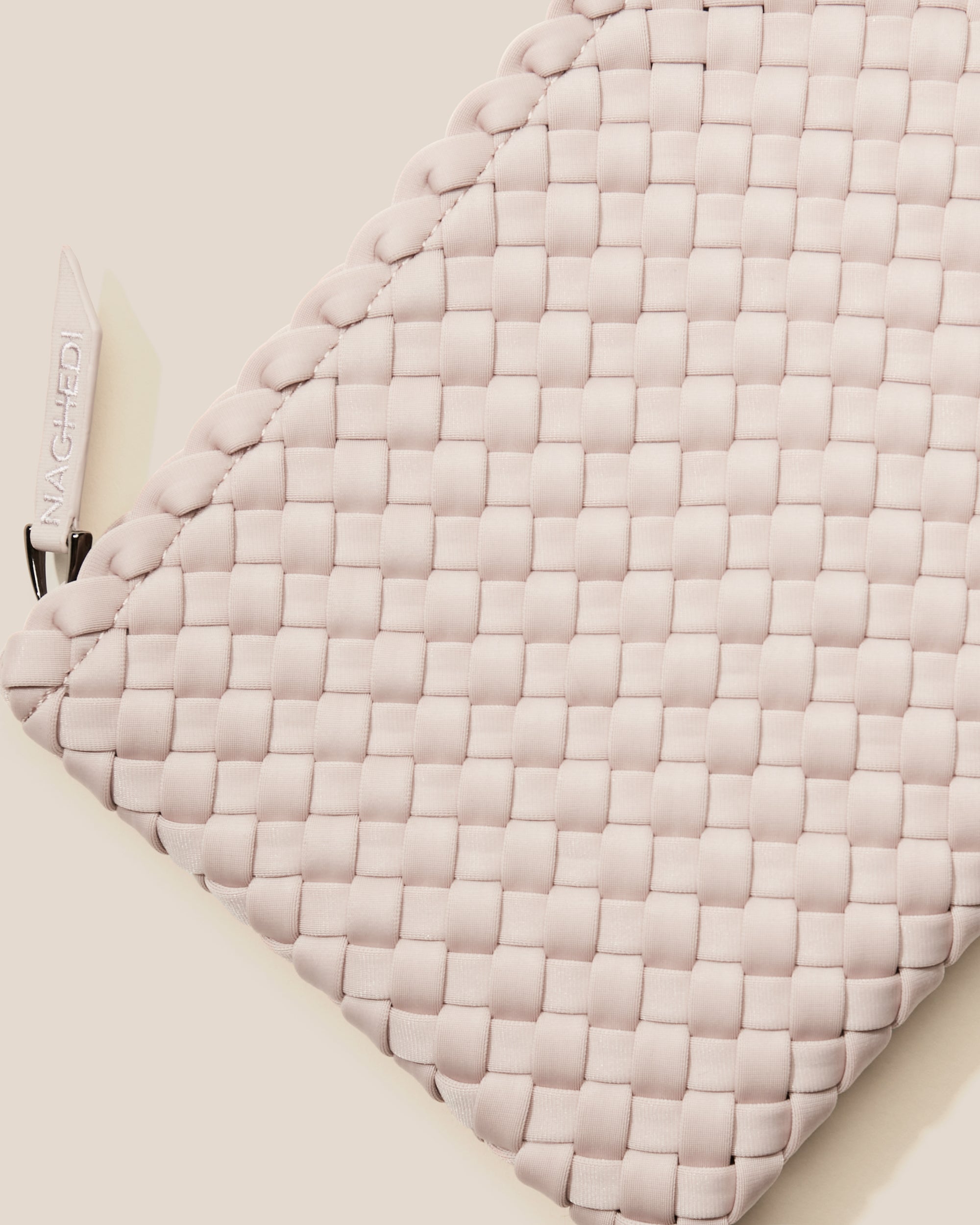 Close-up of included matching woven zippered pouch.