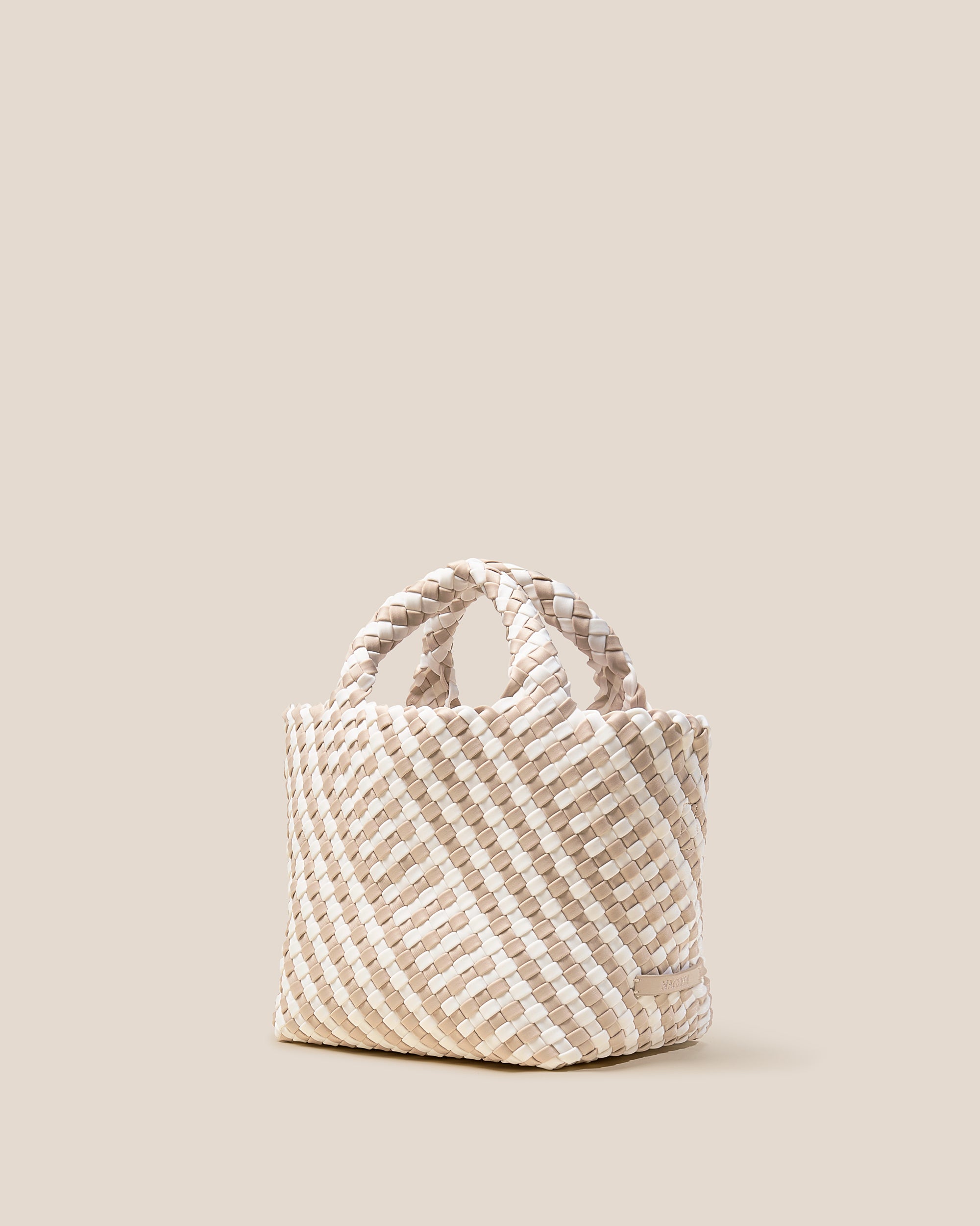 St. Barths Tote in Mykonos shown from a side angle, highlighting its handwoven neoprene construction and open top.