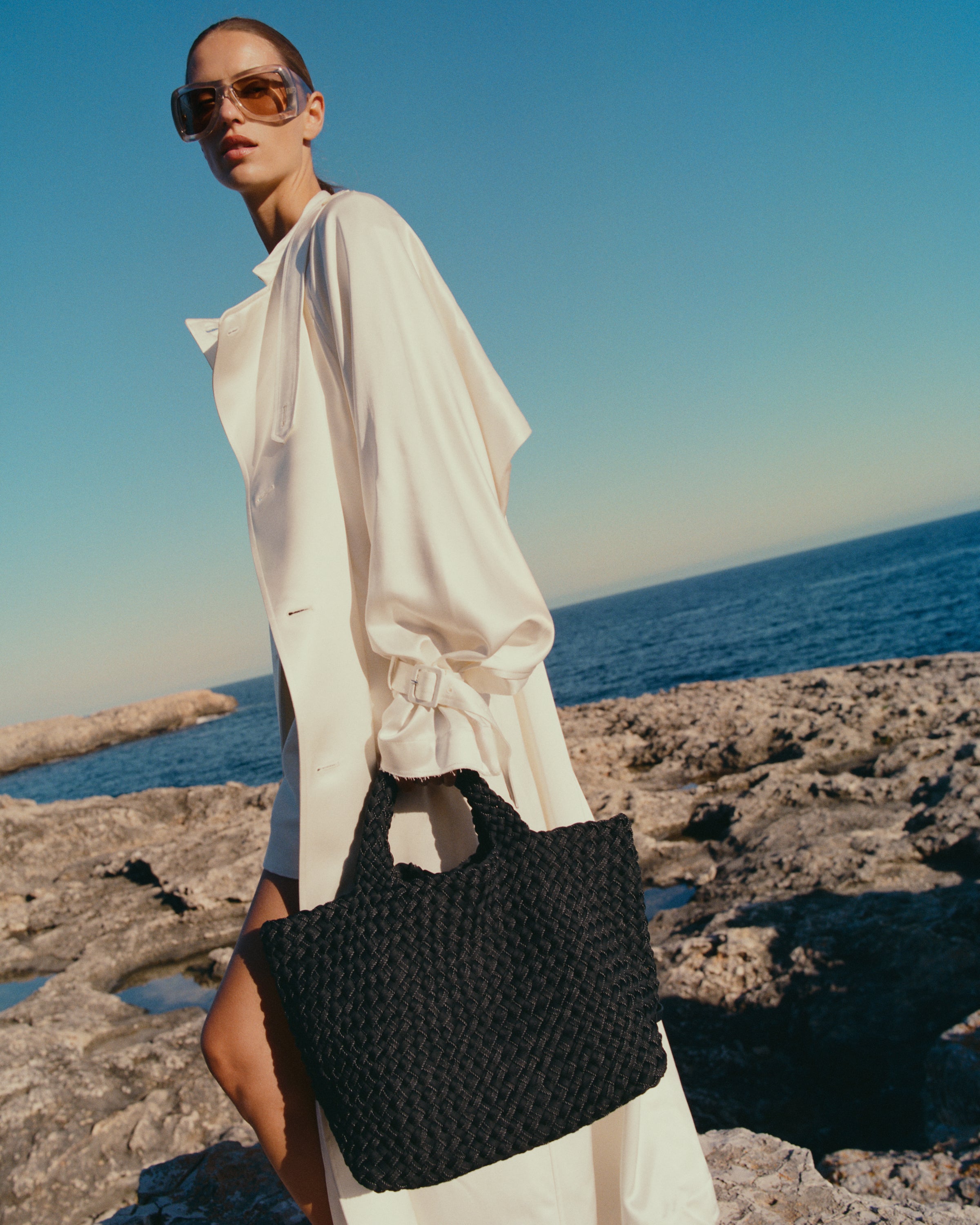 St. Barths Tote in Jet shown on model to illustrate scale and soft silhouette.