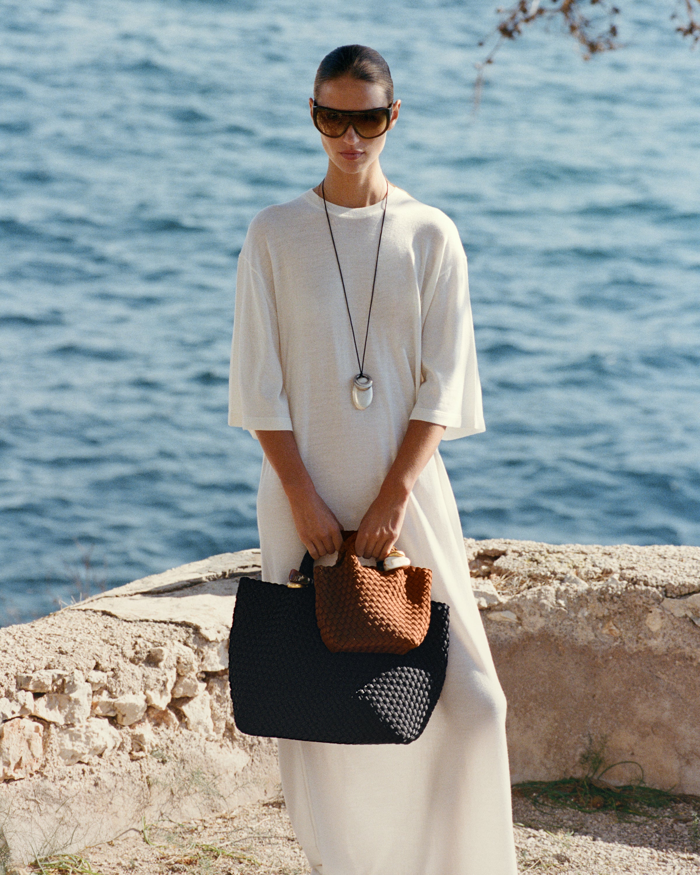 St. Barths Tote in Onyx shown on model to illustrate scale and soft silhouette.
