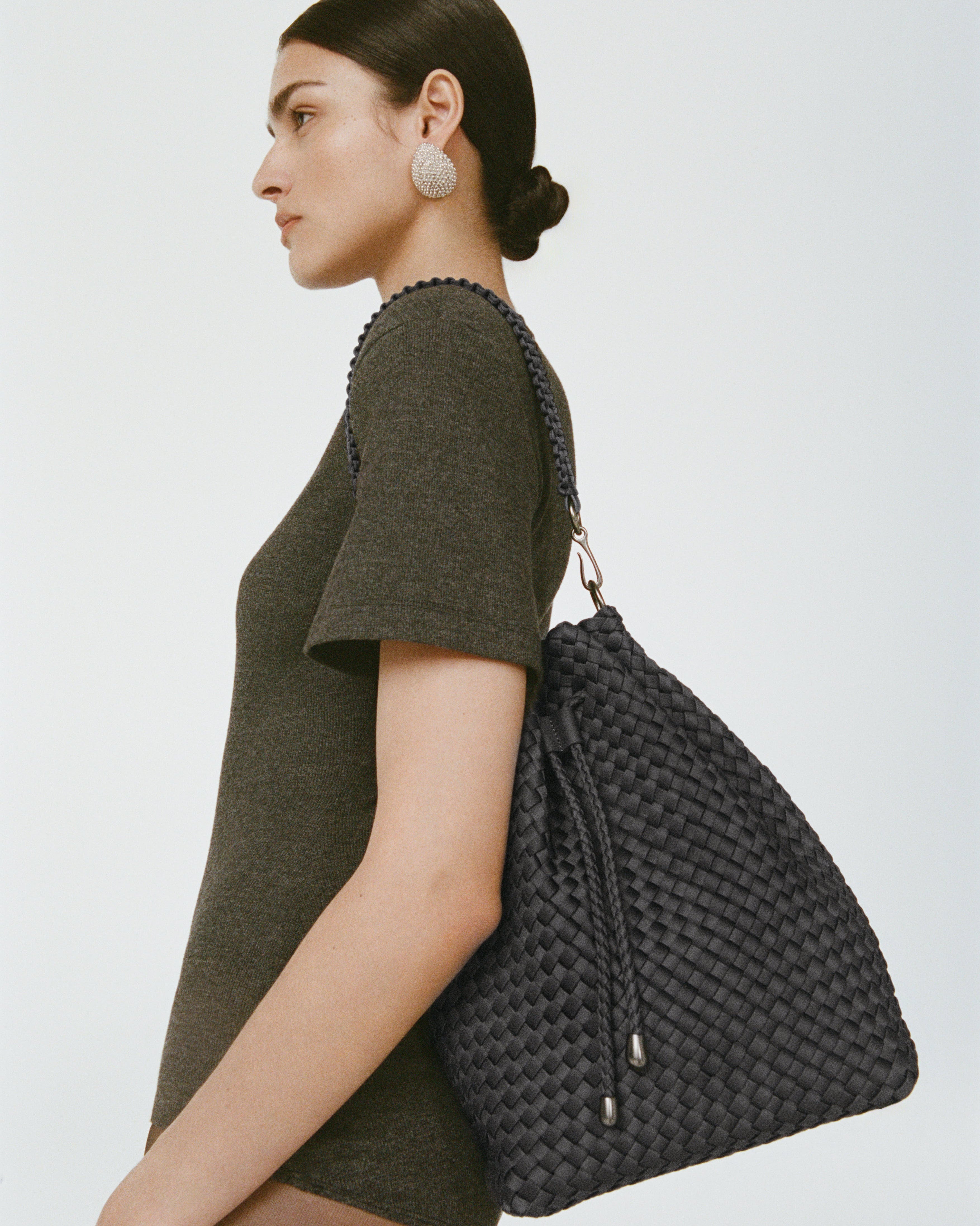 Mercer Bucket in Ash shown on model to illustrate scale and soft silhouette.