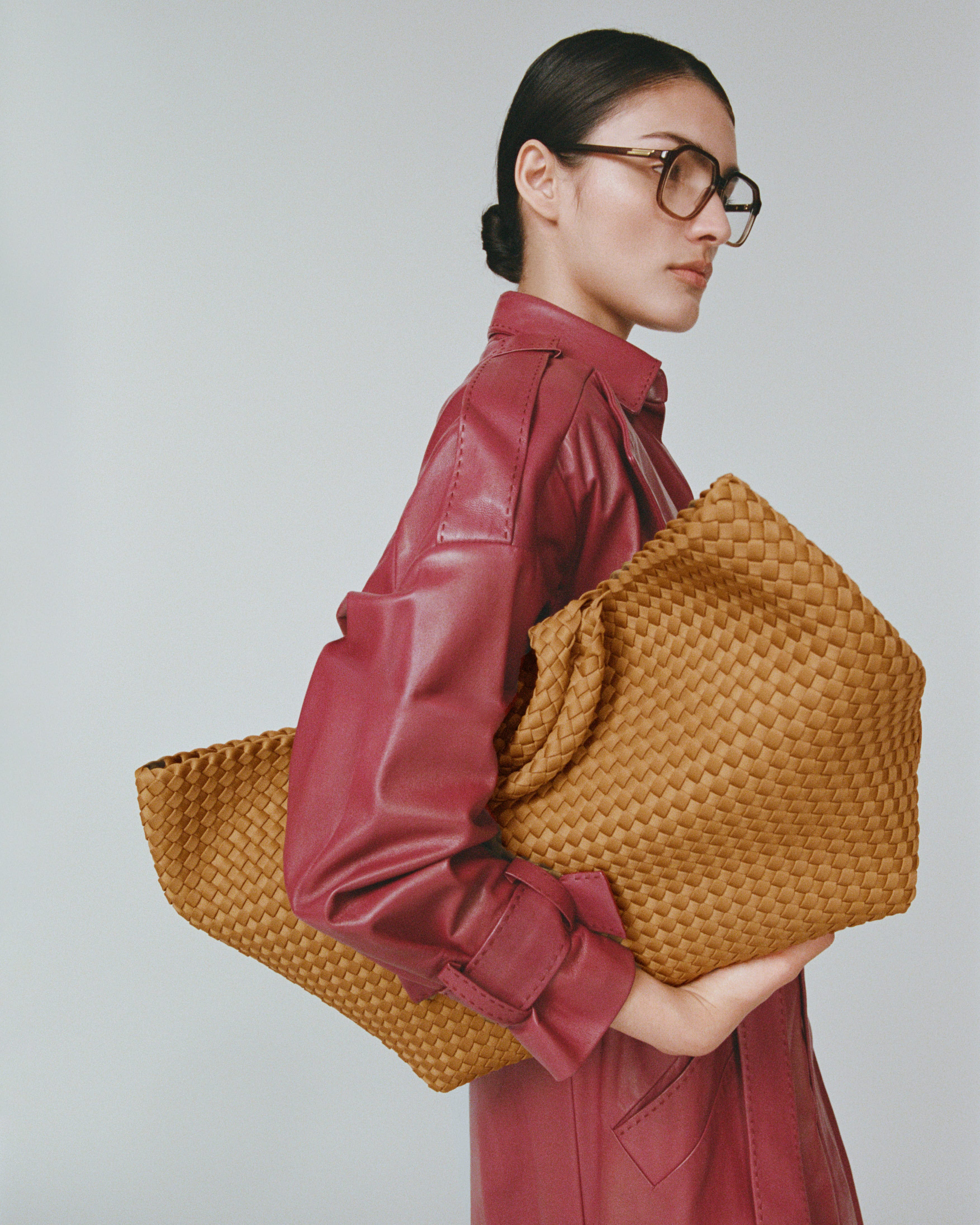 St. Barths Tote in Turmeric shown on model to illustrate scale and soft silhouette.