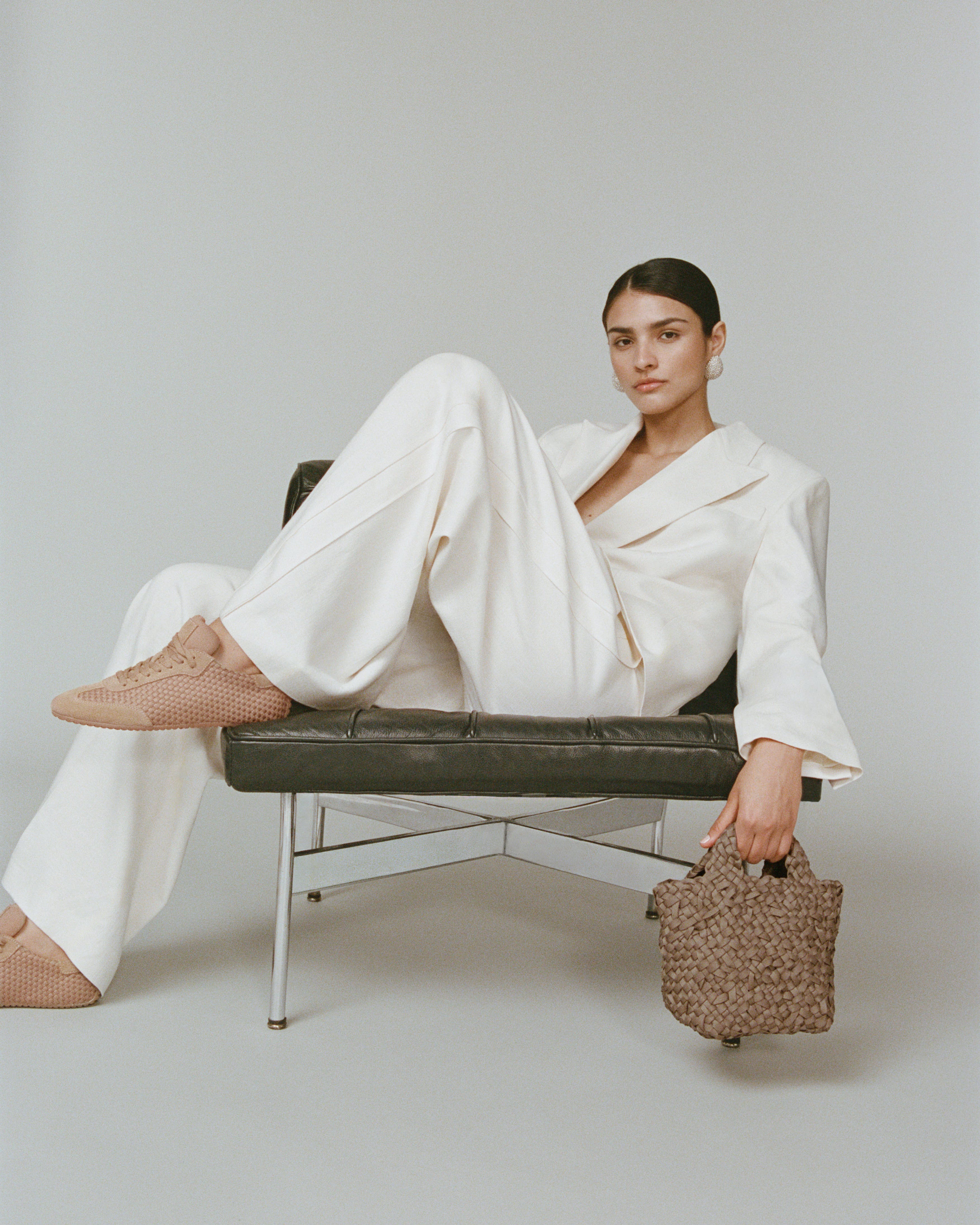 The Milan Sneaker in Seychelles shown on model.