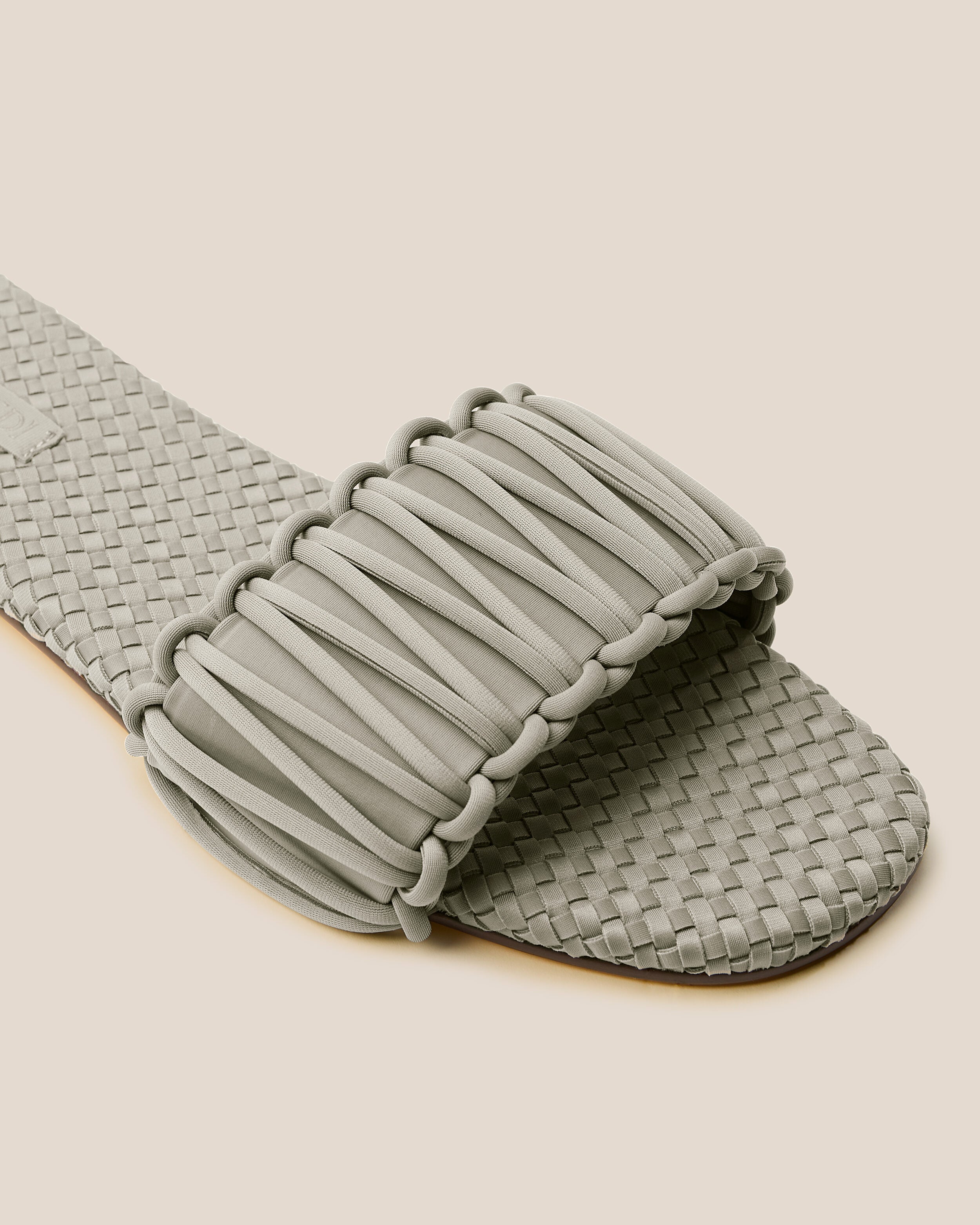 Close-up of The Athens Slide in Celadon showing its open toe and square silhouette.