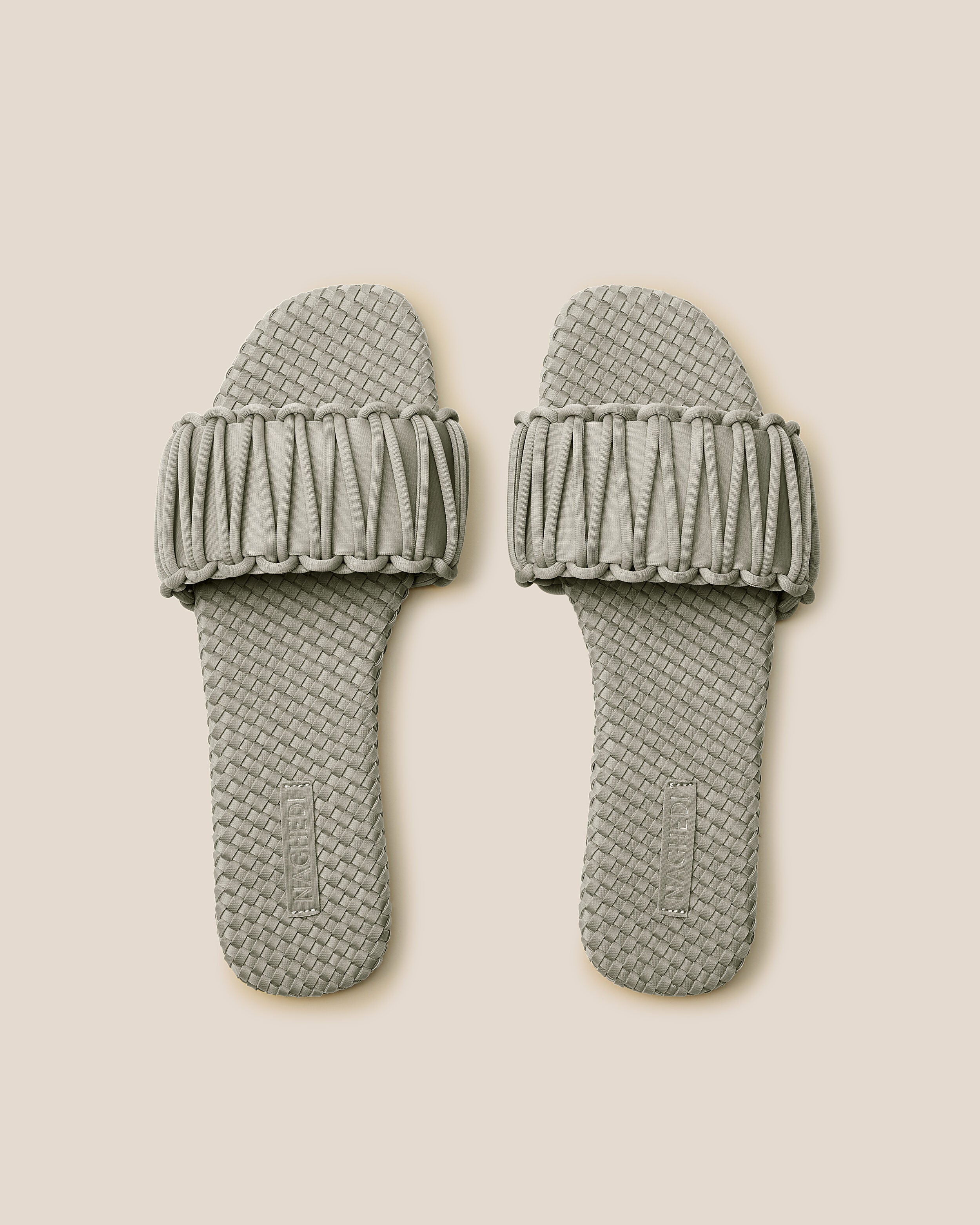 Top view of pair of The Athens Slide in Celadon showing the handwoven neoprene insole.