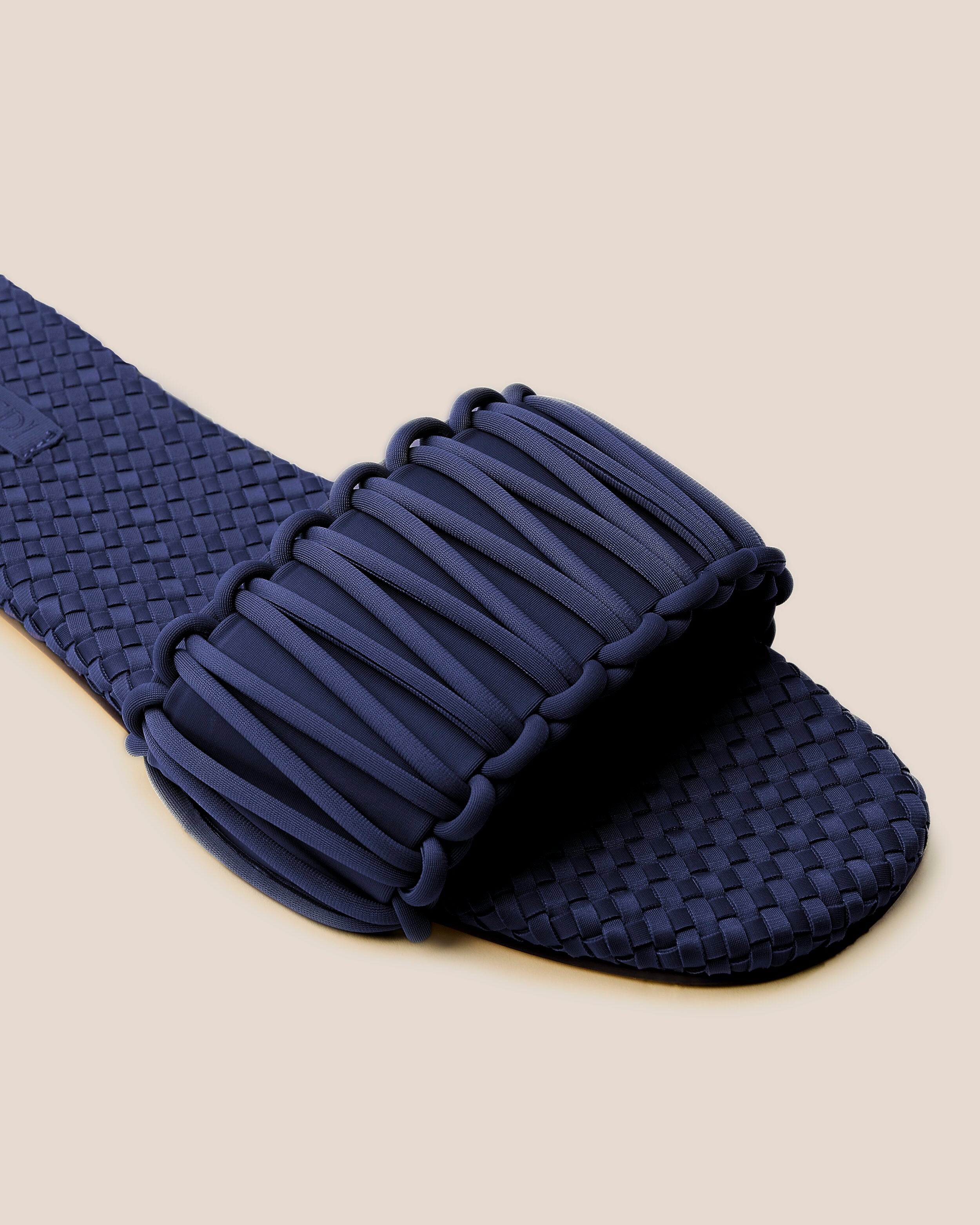 Close-up of The Athens Slide in Ink Blue showing its open toe and square silhouette.