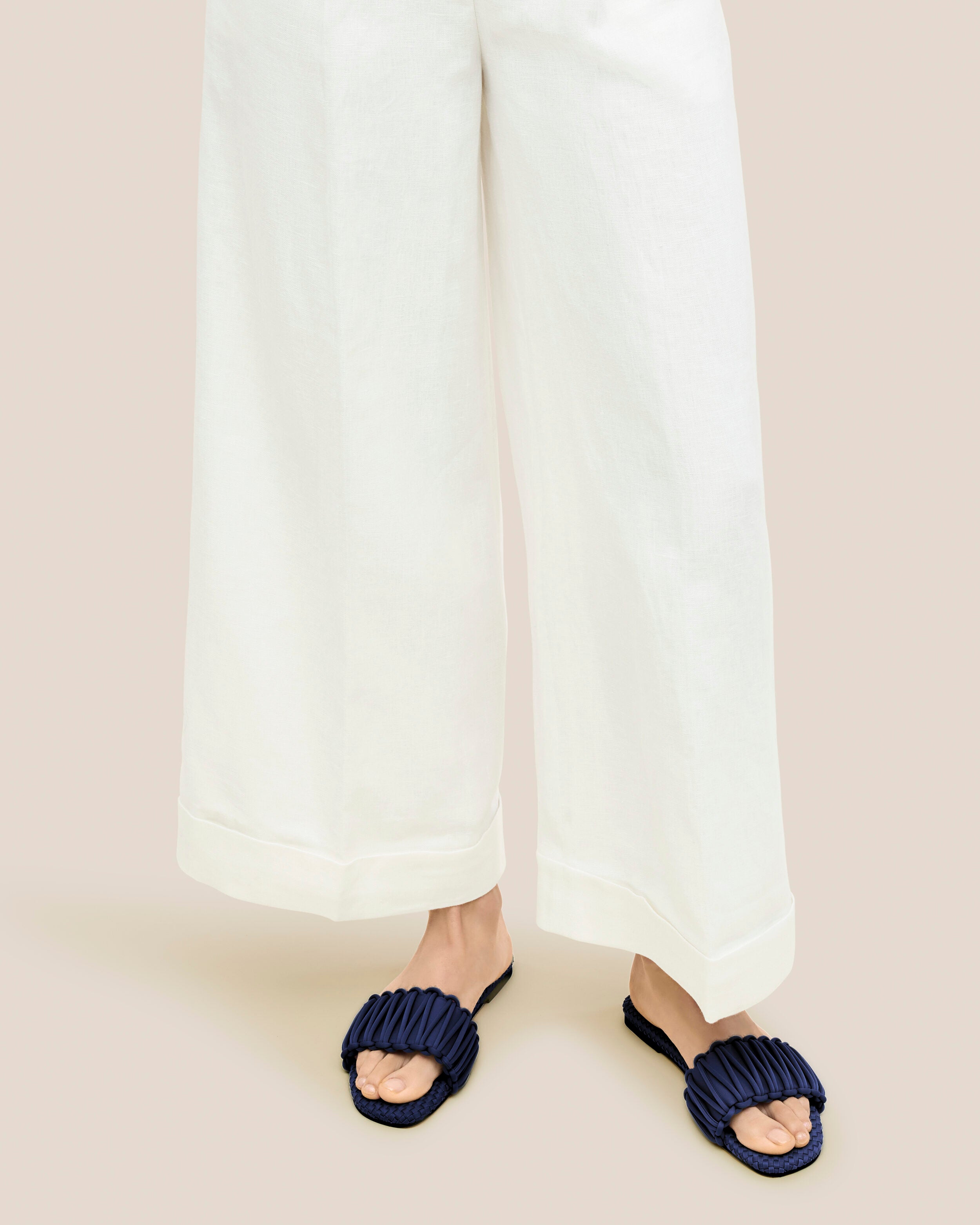 The Athens Slide in Ink Blue shown on model.