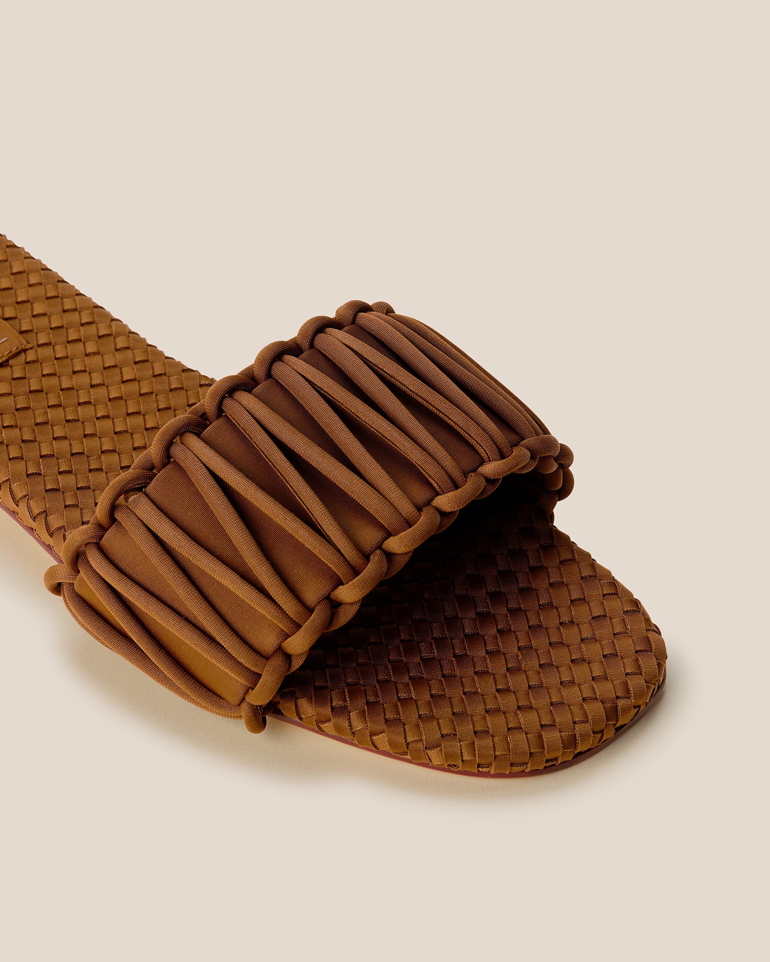 Close-up of The Athens Slide in Teak showing its open toe and square silhouette.