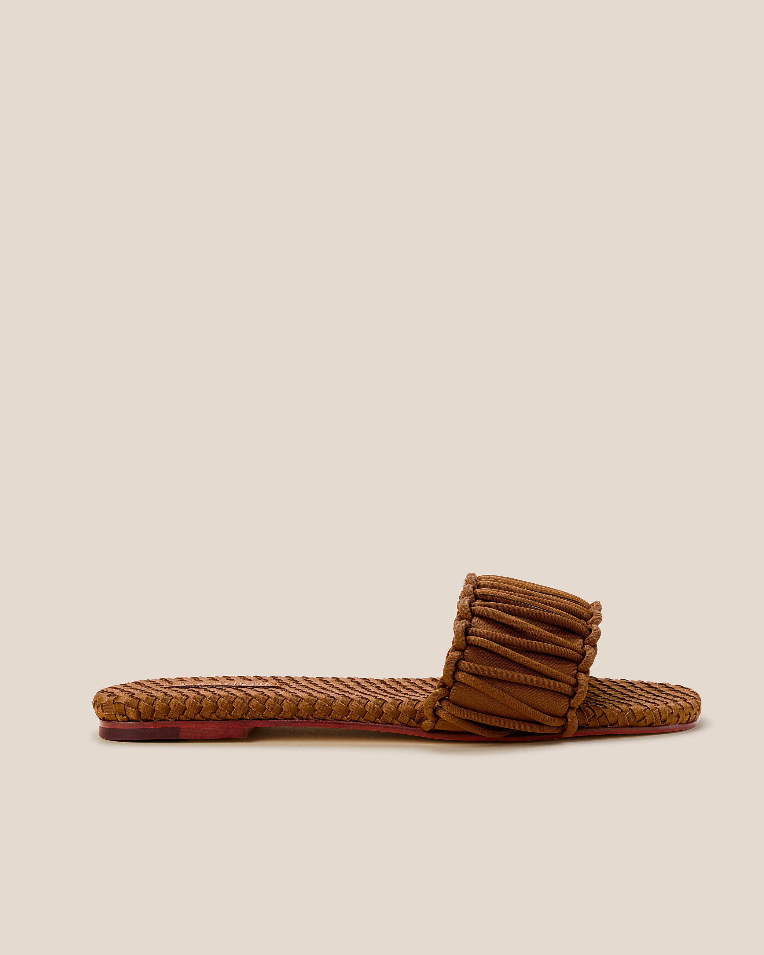 Side view of The Athens Slide in Teak, a saddle brown tone, featuring an open toe and square silhouette.